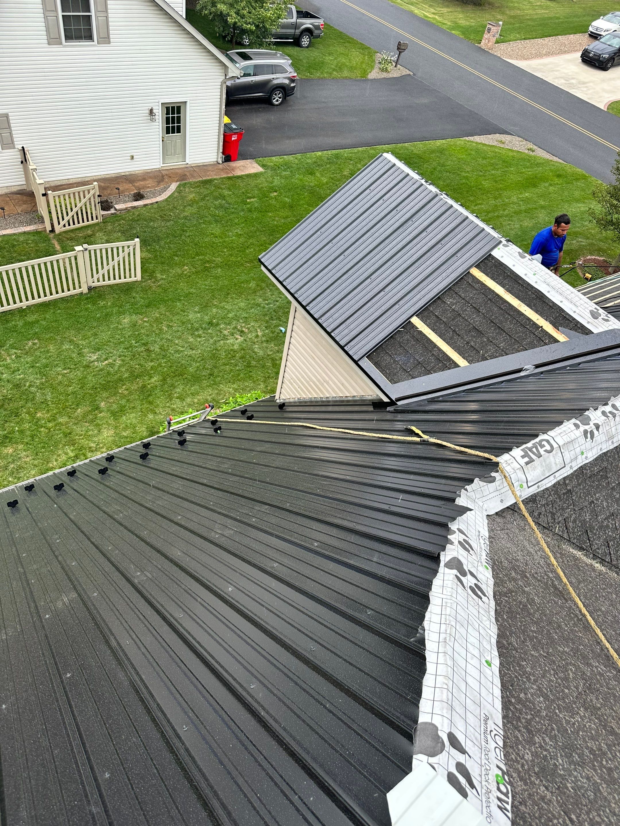 Standing seam / Azm panel in black  by Teflon Roofing