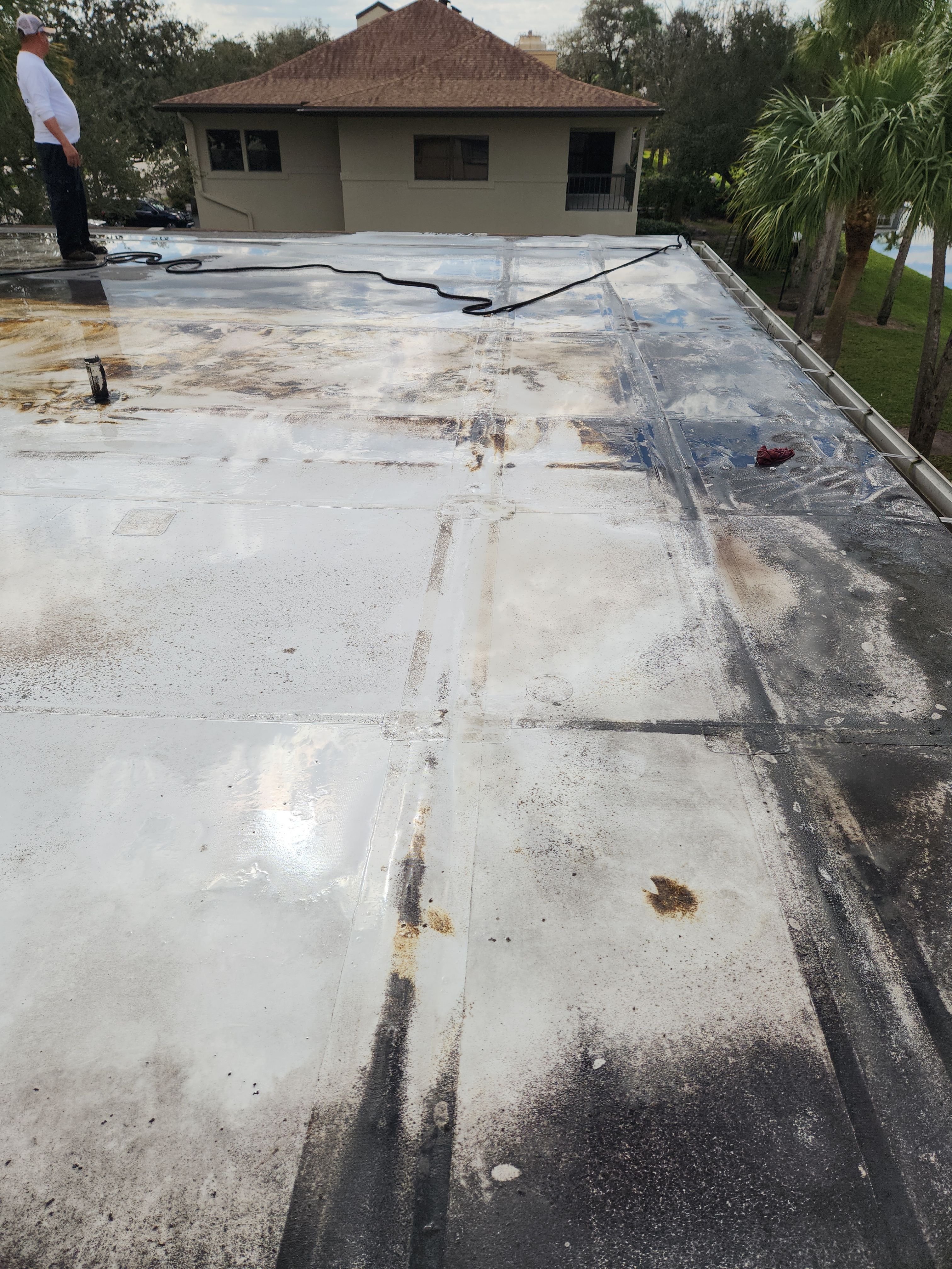Reflective Silicone Roof Coating and Maintenance in Palm Beach Gardens by Aastro Roofing