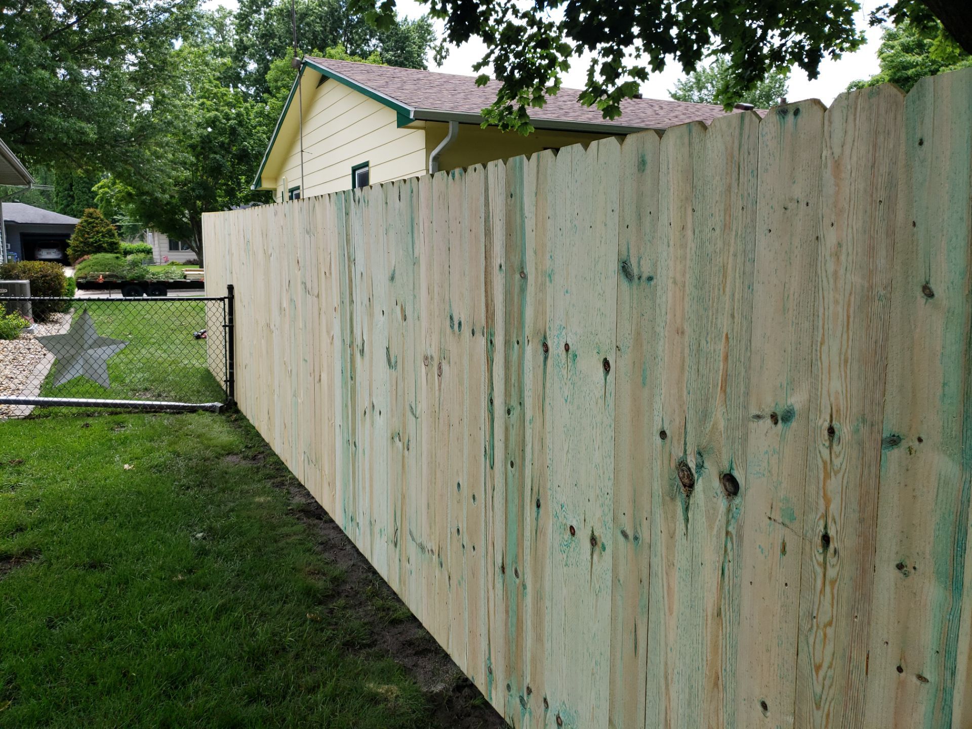 Custom Wood Privacy Fence Installation for Charles City Backyard by Perfect Picket Fence and Stain