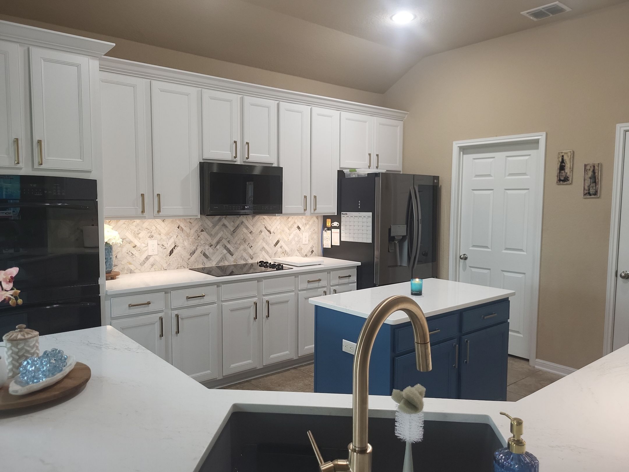 Cibolo Kitchen Refresh with Painted Cabinets, Quartz Countertops & Herringbone Backsplash by Legacy Bath and Kitchen 