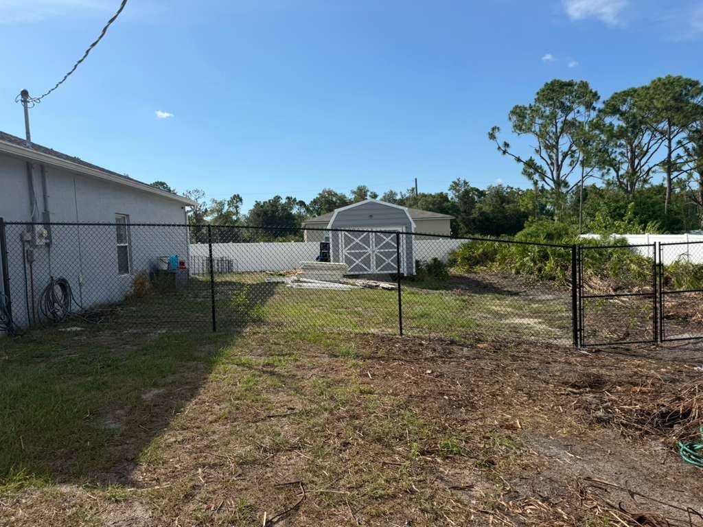 Black Chain Link and Vinyl Privacy Fence Installation in North Port by True Fence LLC