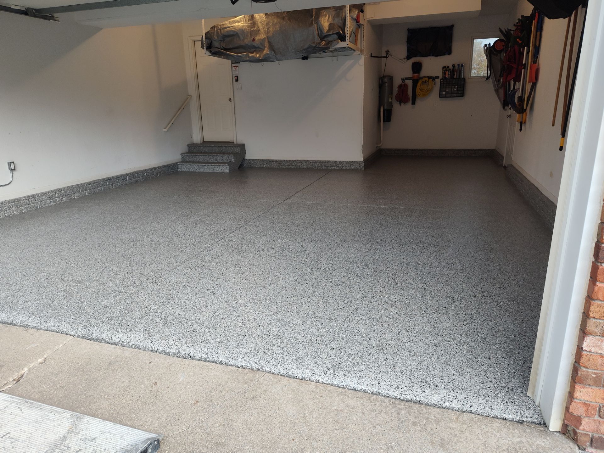 A Garage In One Day Keeps the Rock Salt Away! by Revival Concrete Coatings