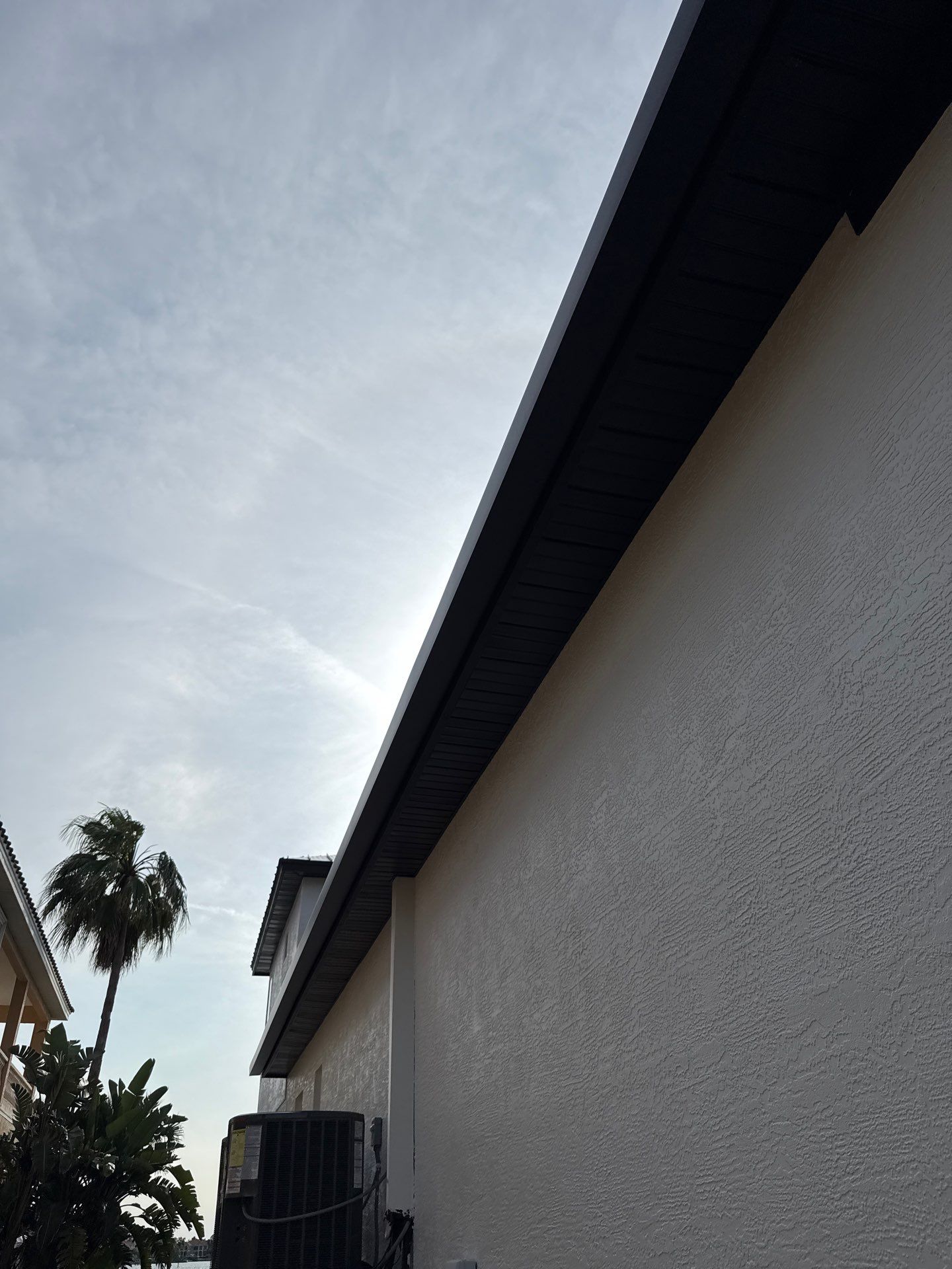 Soffit and Fascia Installation and black seamless gutters in Sarasota FL by Gutter Professors