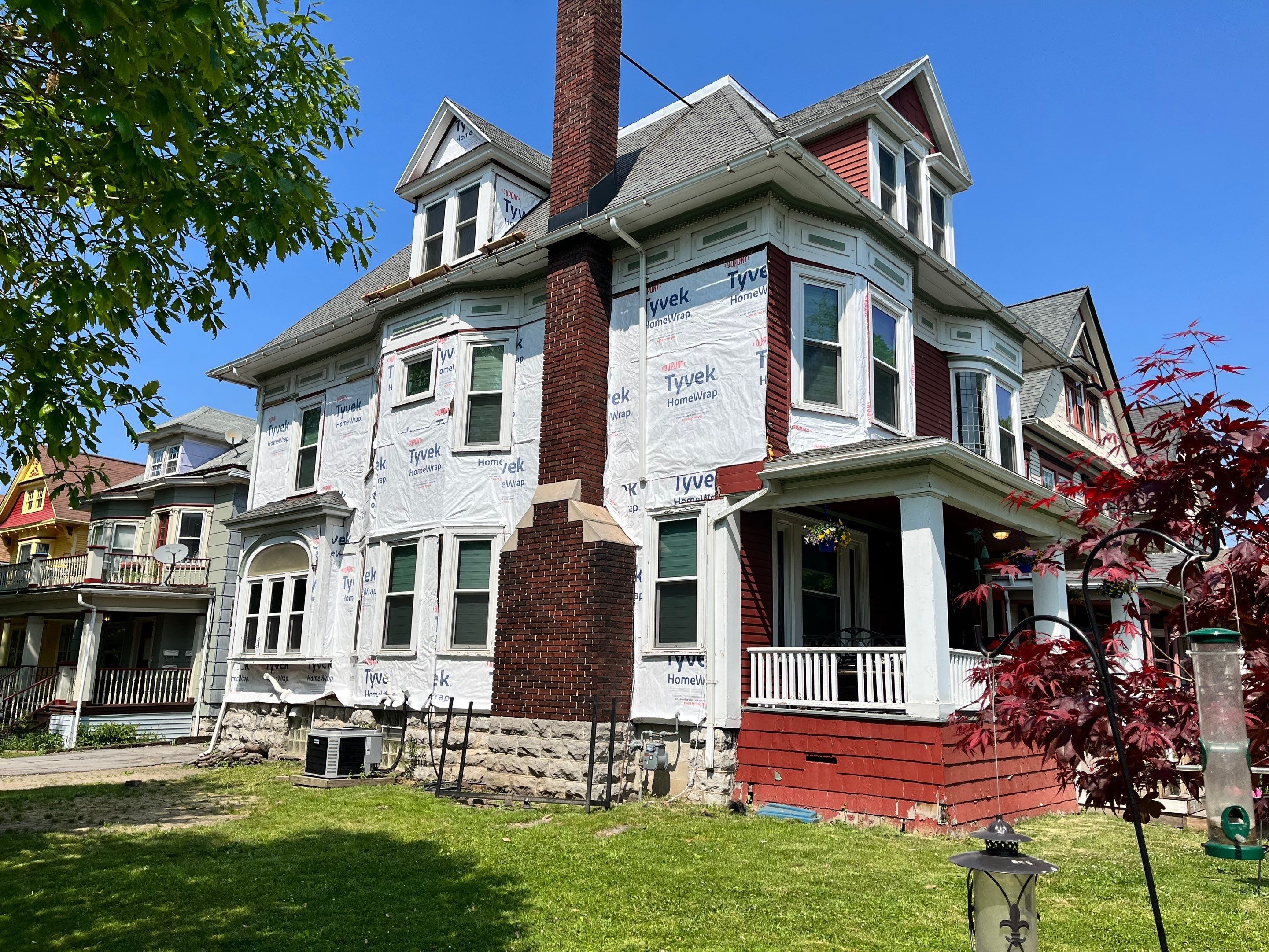 Exterior Renovations- Siding, Stamped Concrete, Porch, and Railings by Ivy Lea Construction