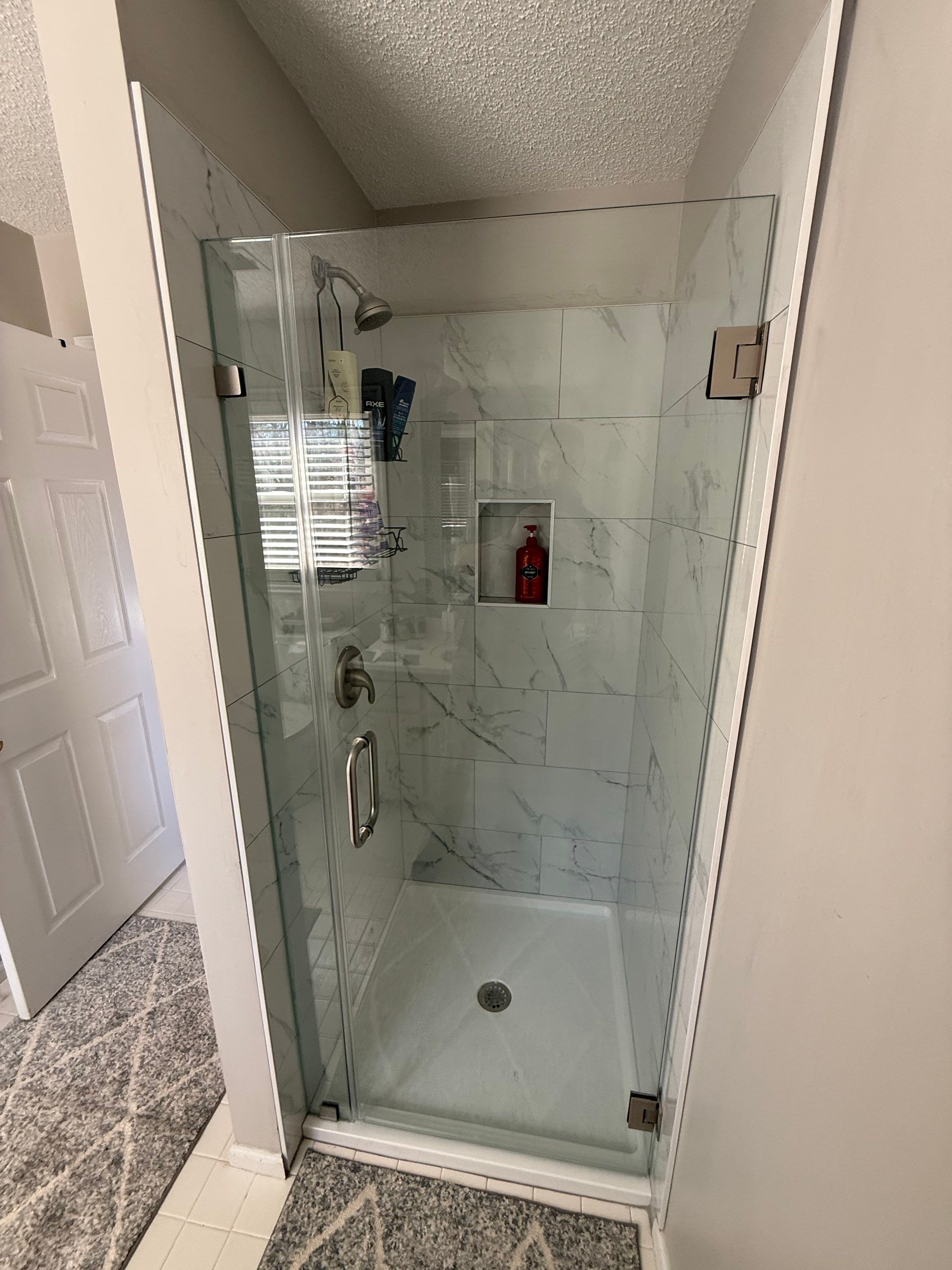 Walk-In Shower Renovation with Marble Tile in Powder Springs by Swift Home Renovations