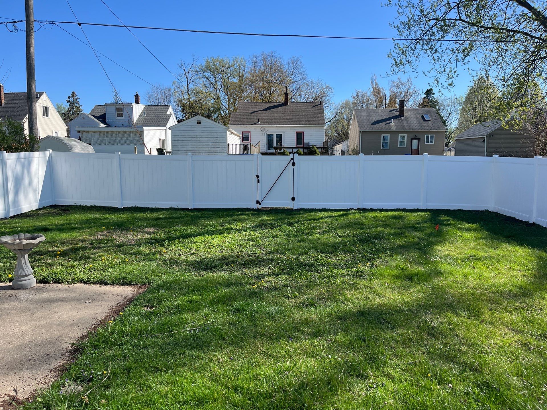 Residential White Vinyl Privacy Fence Installation in Waterloo, Iowa by Perfect Picket Fence and Stain