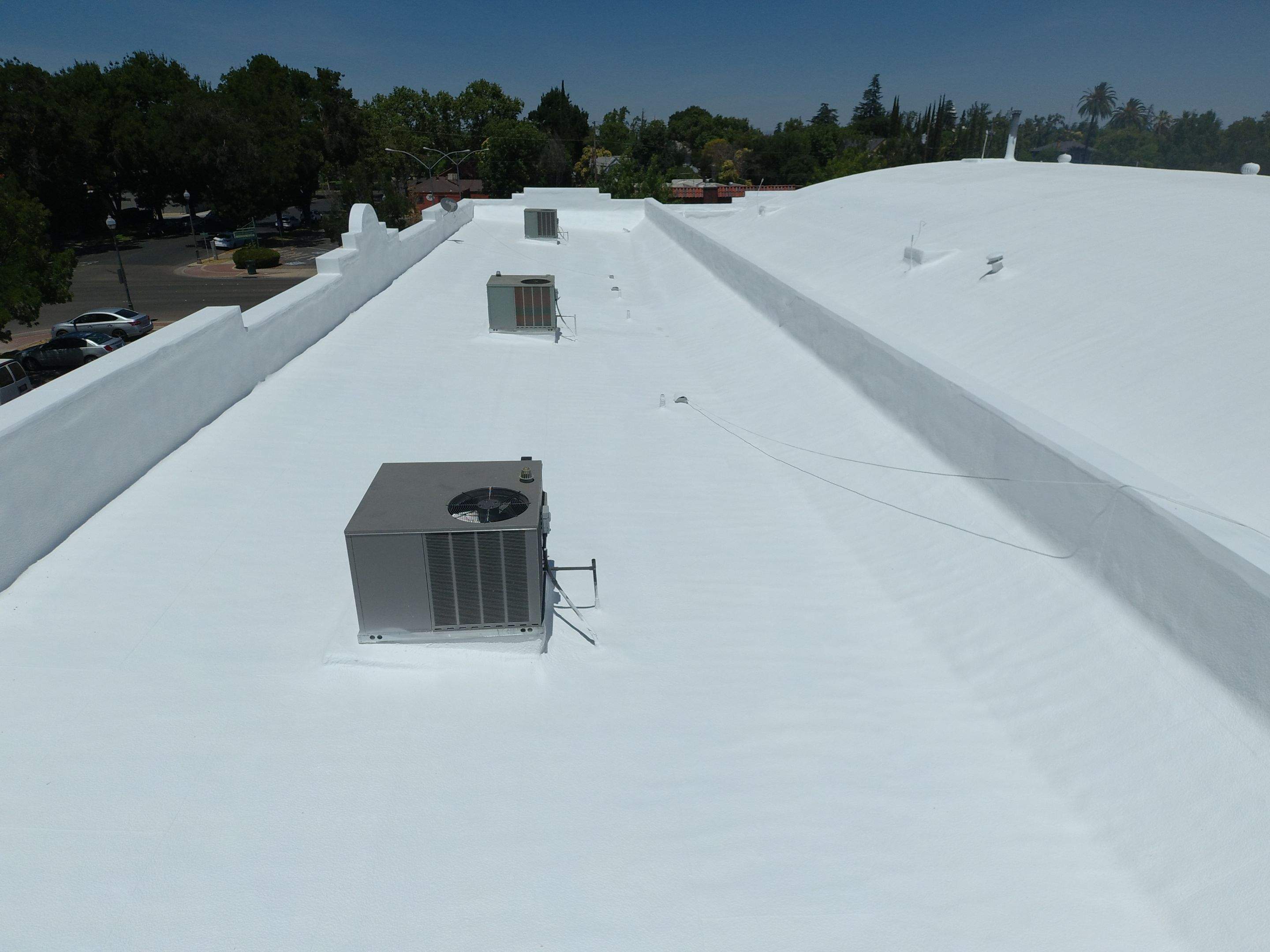 Spray foam and coatings using Conklin Benchmark/PUMA XL coatings and spray foam by Straight Edge Roofing Inc
