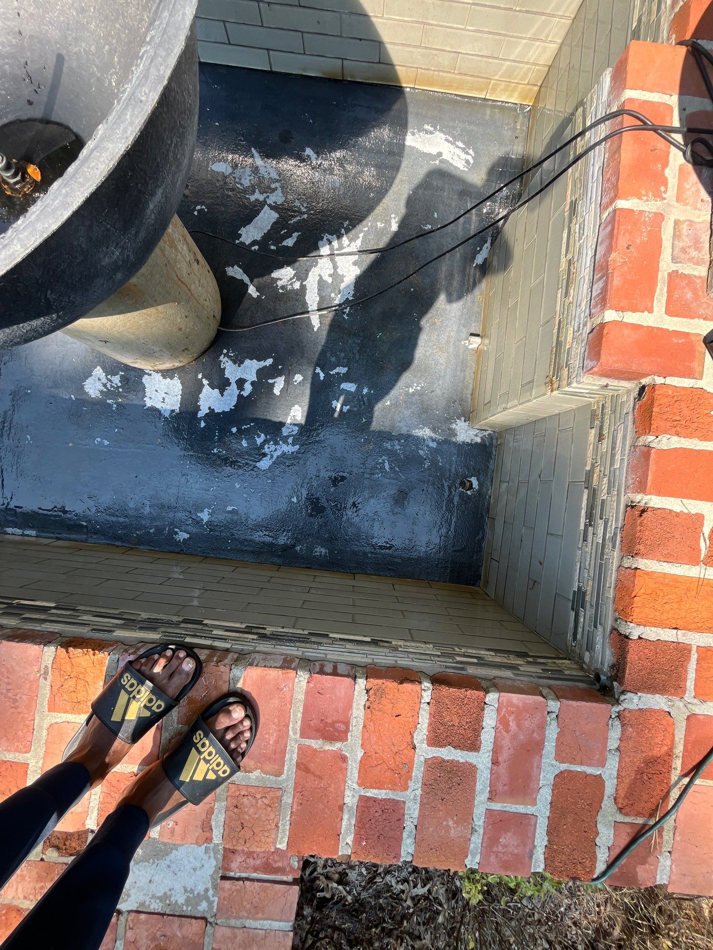 Pool Cleaning using Pool Cleaner by College Bros Outdoor services