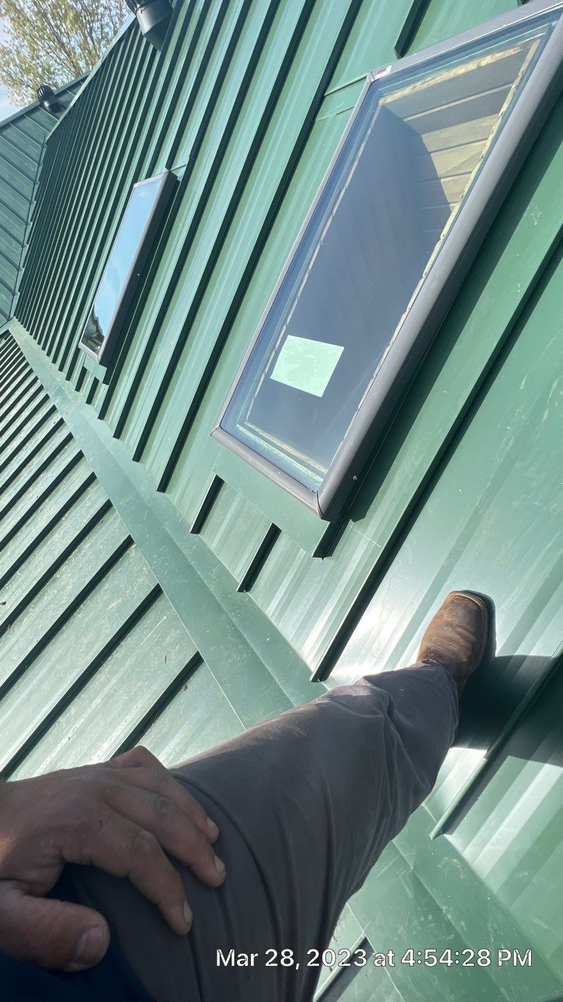 Shingle to Standing Seam Metal Roof by Springtree Restoration 