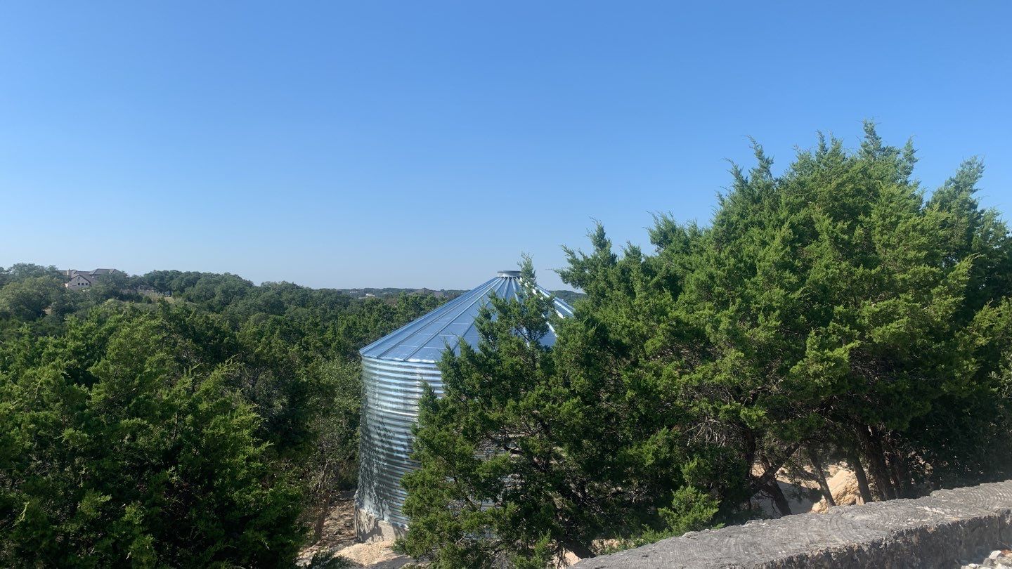 Cliffside installation for primary water source. by Hill Country Rain Water