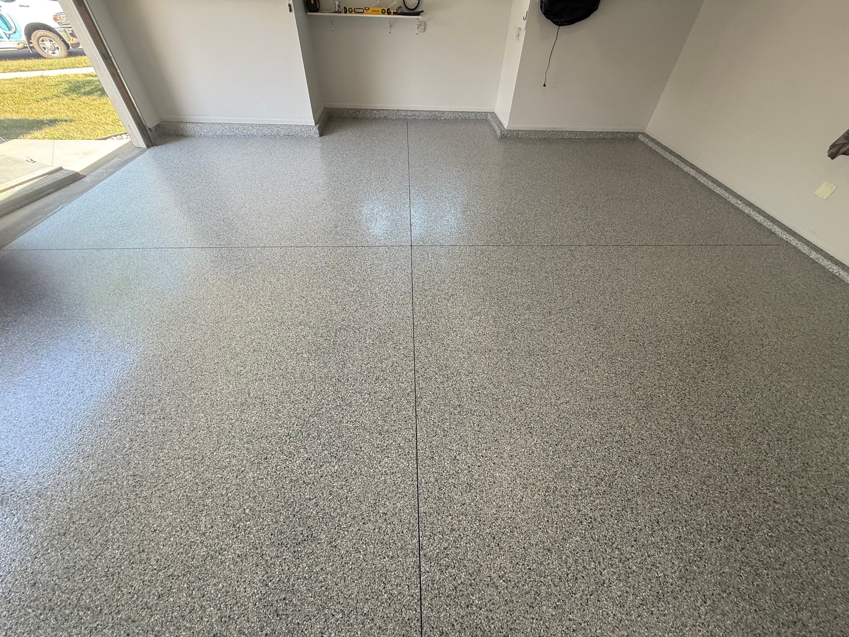 Decorative Chip Epoxy Floor Coating Installation in Sioux Falls by Select Painting, Coatings & Garage Cabinets