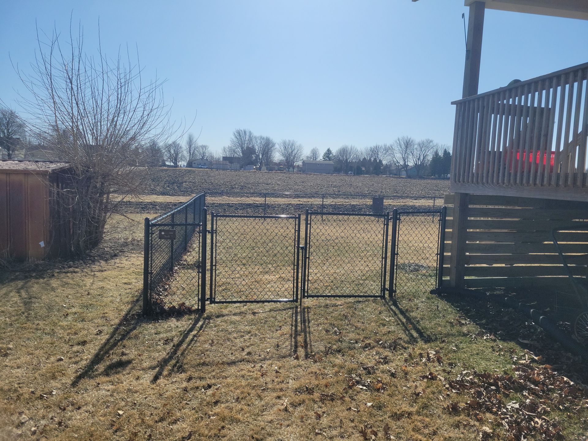 Residential Black Chain Link Fence and Gate Installation in Tripoli by Perfect Picket Fence and Stain
