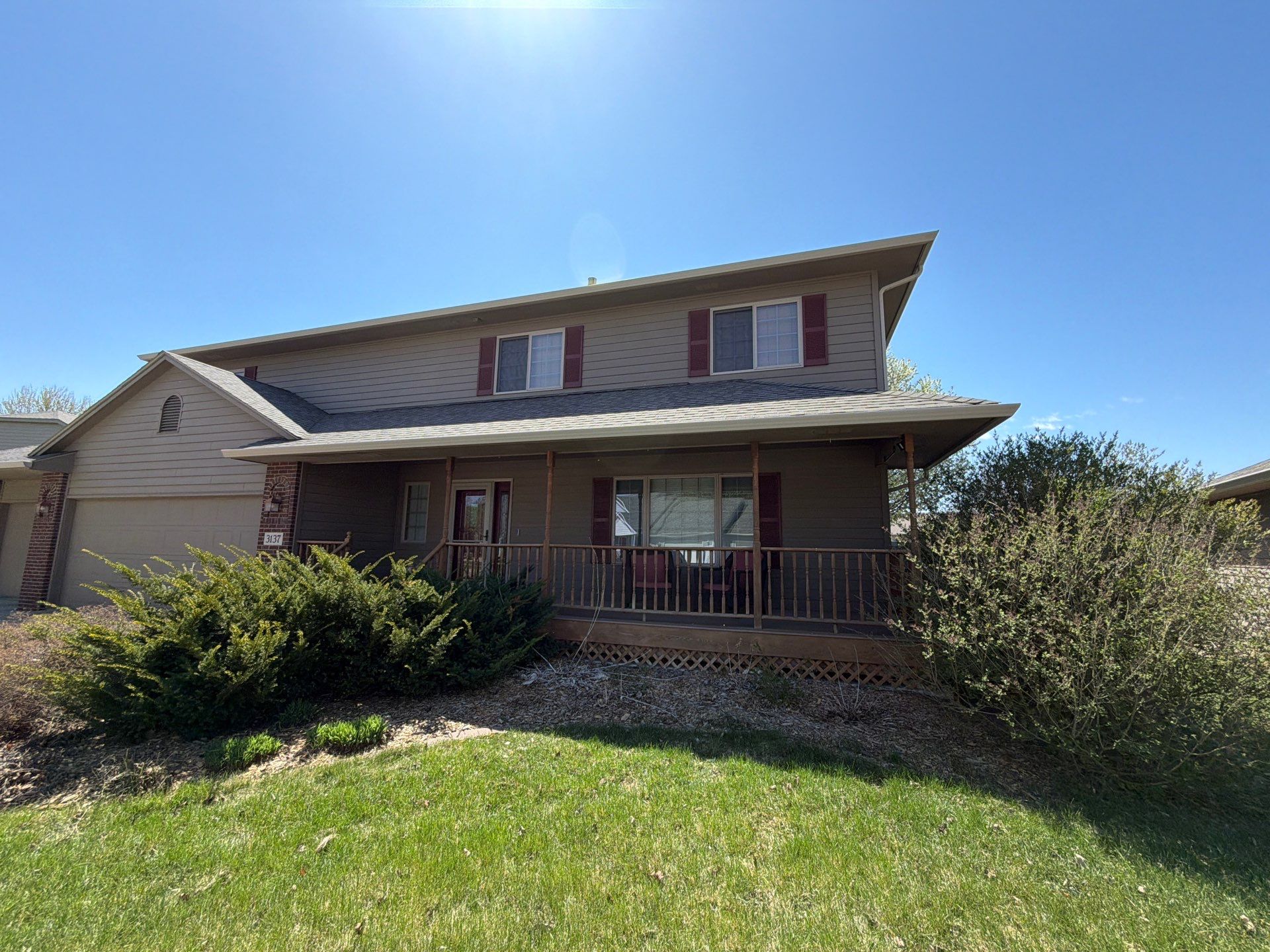 Residential Exterior Painting with Shutter and Trim Updates in Sioux Falls by Select Painting, Coatings & Garage Cabinets