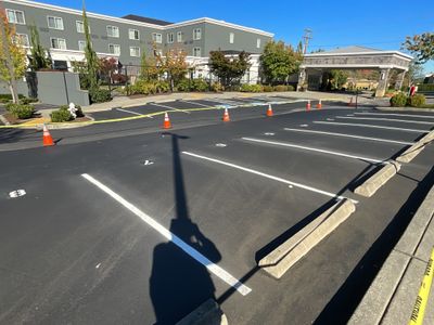 Maggie | Patch Repair, Sealcoating and Striping