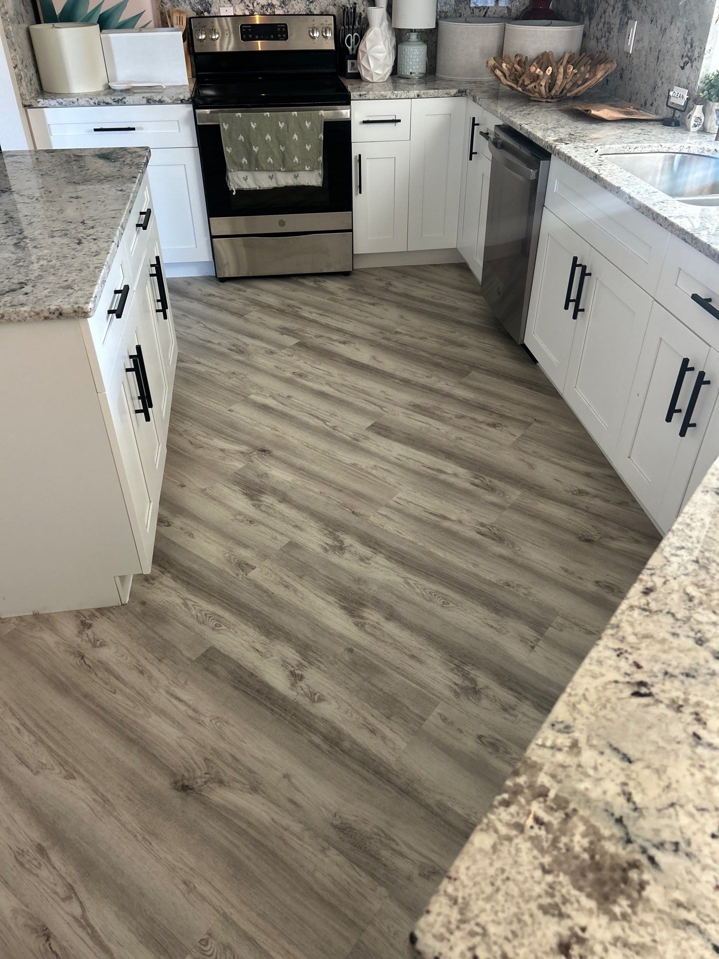 LVP Install in living room/ Kitchen by Vrmmm Flooring