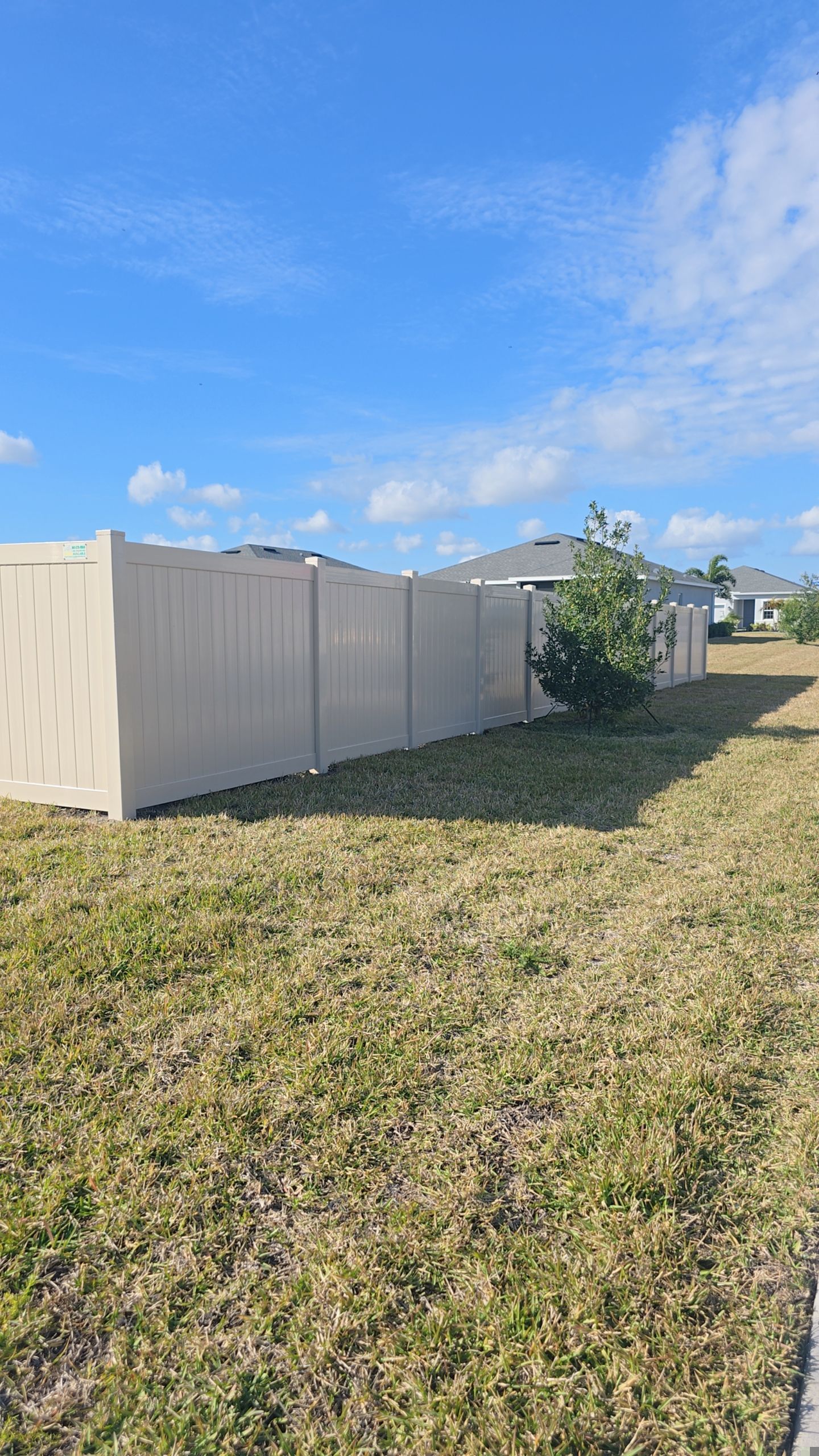 Tan Vinyl Fence in West Port by True Fence LLC