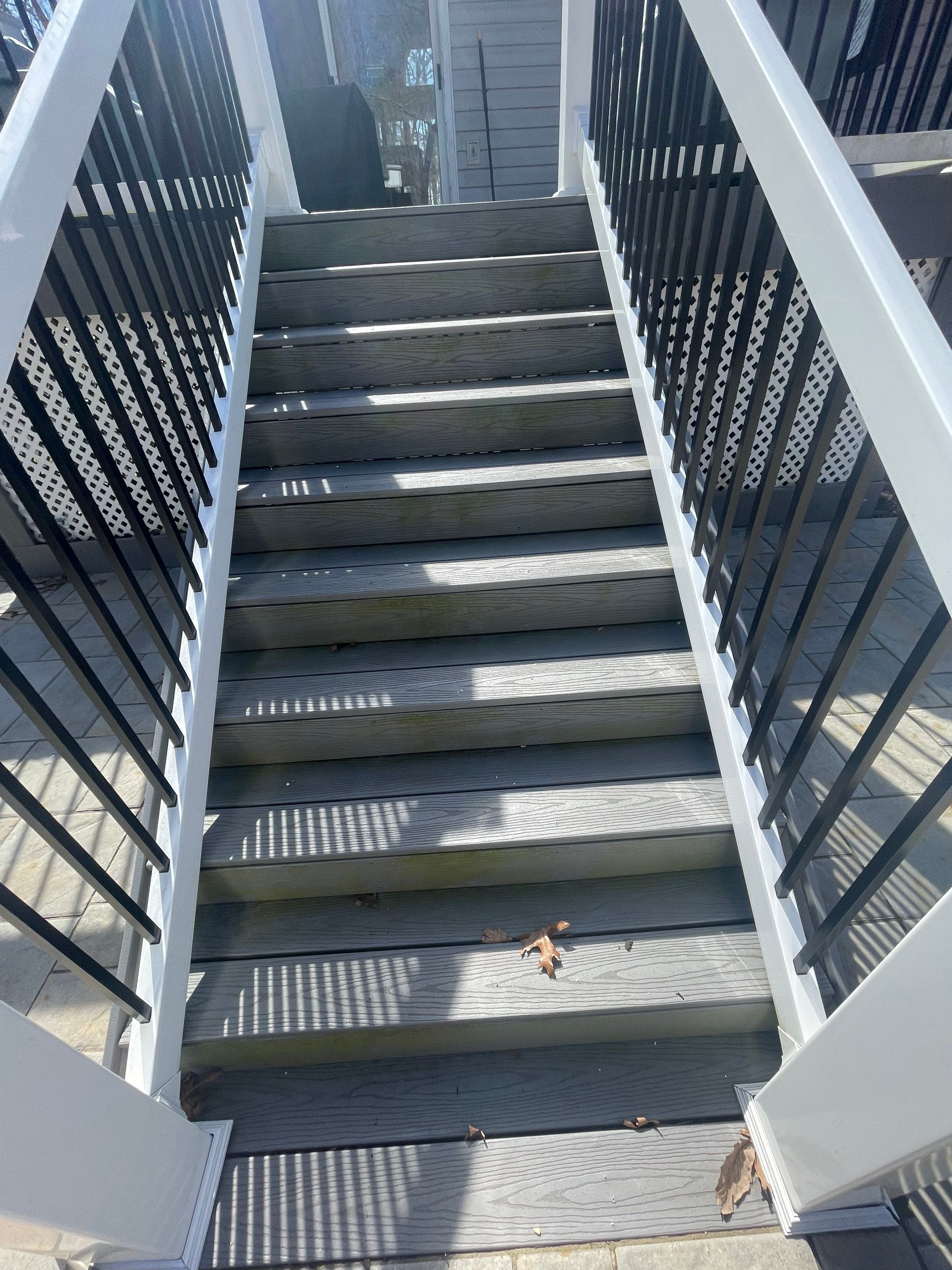 Pressure treated wood deck cleaned by SJ Exterior