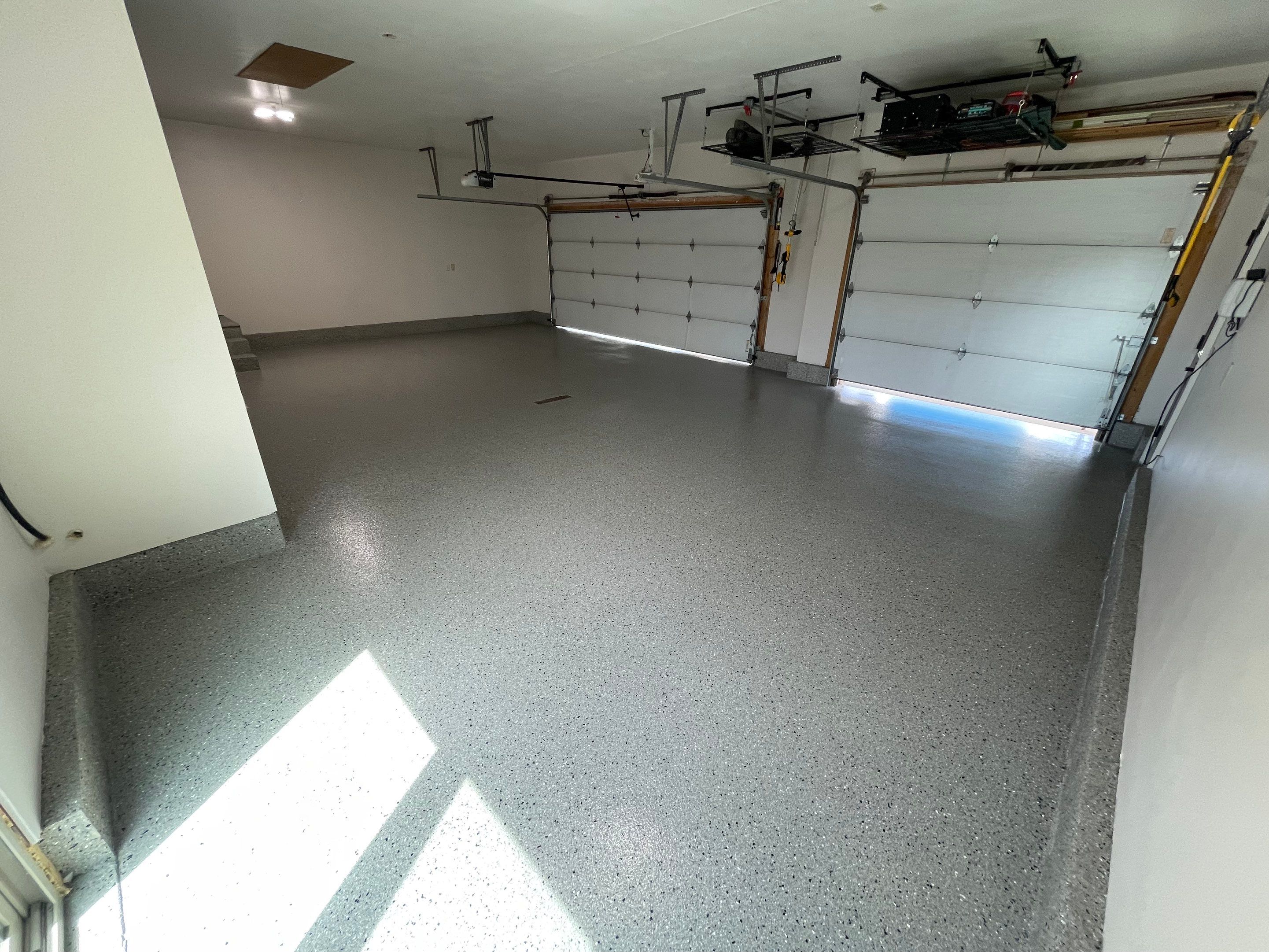 Residential Garage Floor Coating with Grey Speckled Epoxy Finish by Select Painting, Coatings & Garage Cabinets
