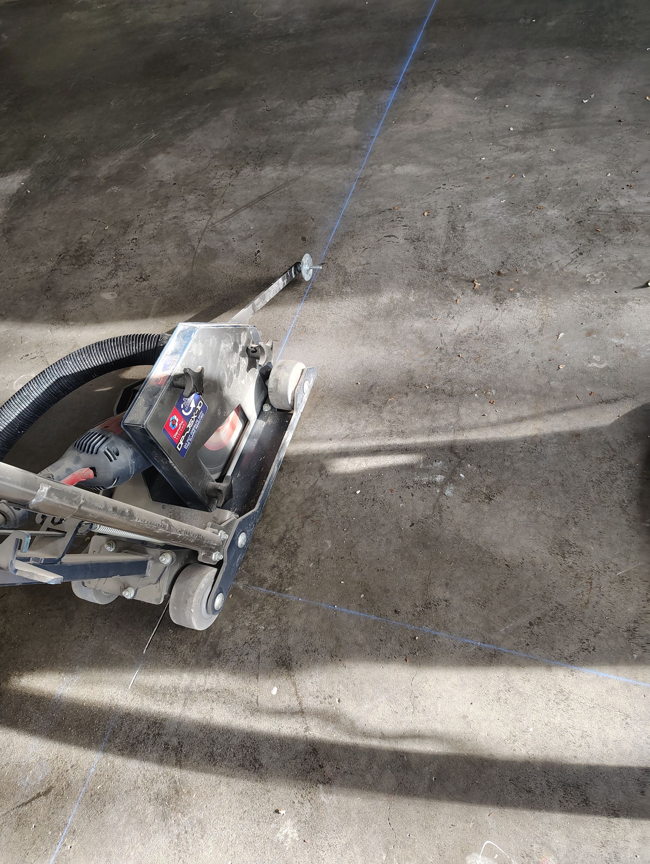 Garage Floor Concrete Coating and Crack Repair in Sioux Falls by Select Painting, Coatings & Garage Cabinets