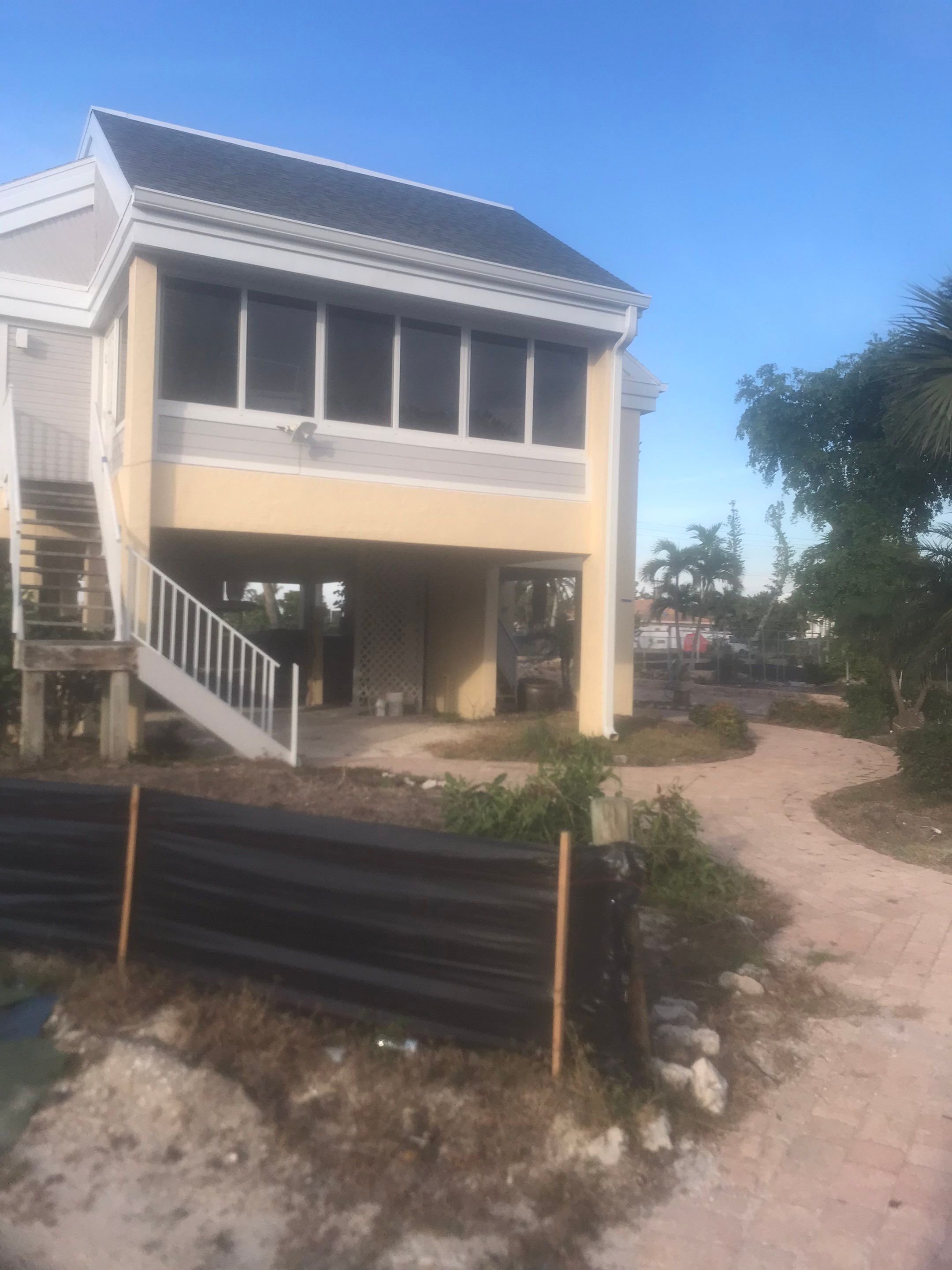 K-Style Seamless Gutter Installation using White Seamless Gutters in Sanibel FL by Gutter Professors