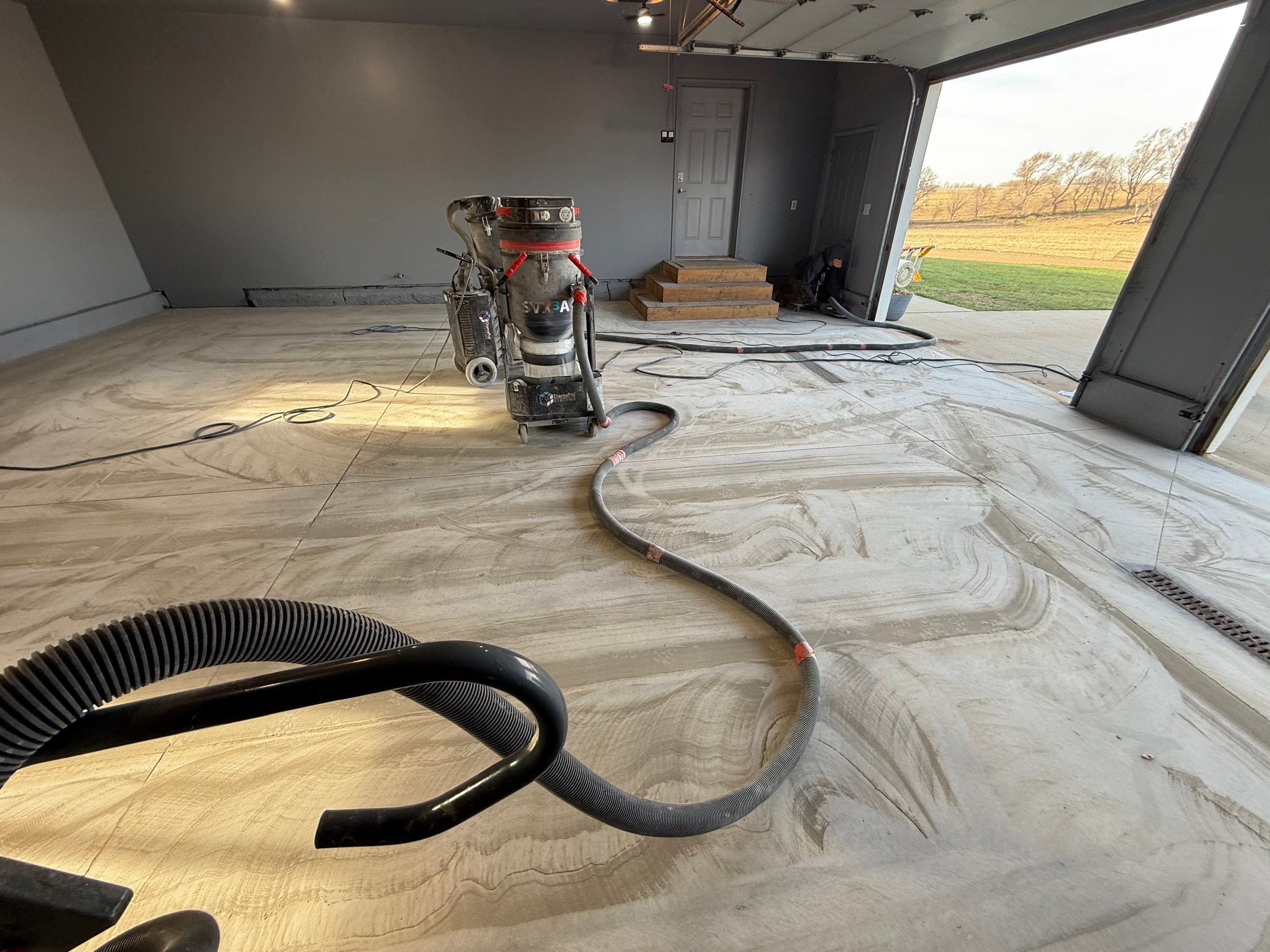 Grey Granite-Style Garage Floor Coating and Stairs in Hartford by Select Painting, Coatings & Garage Cabinets