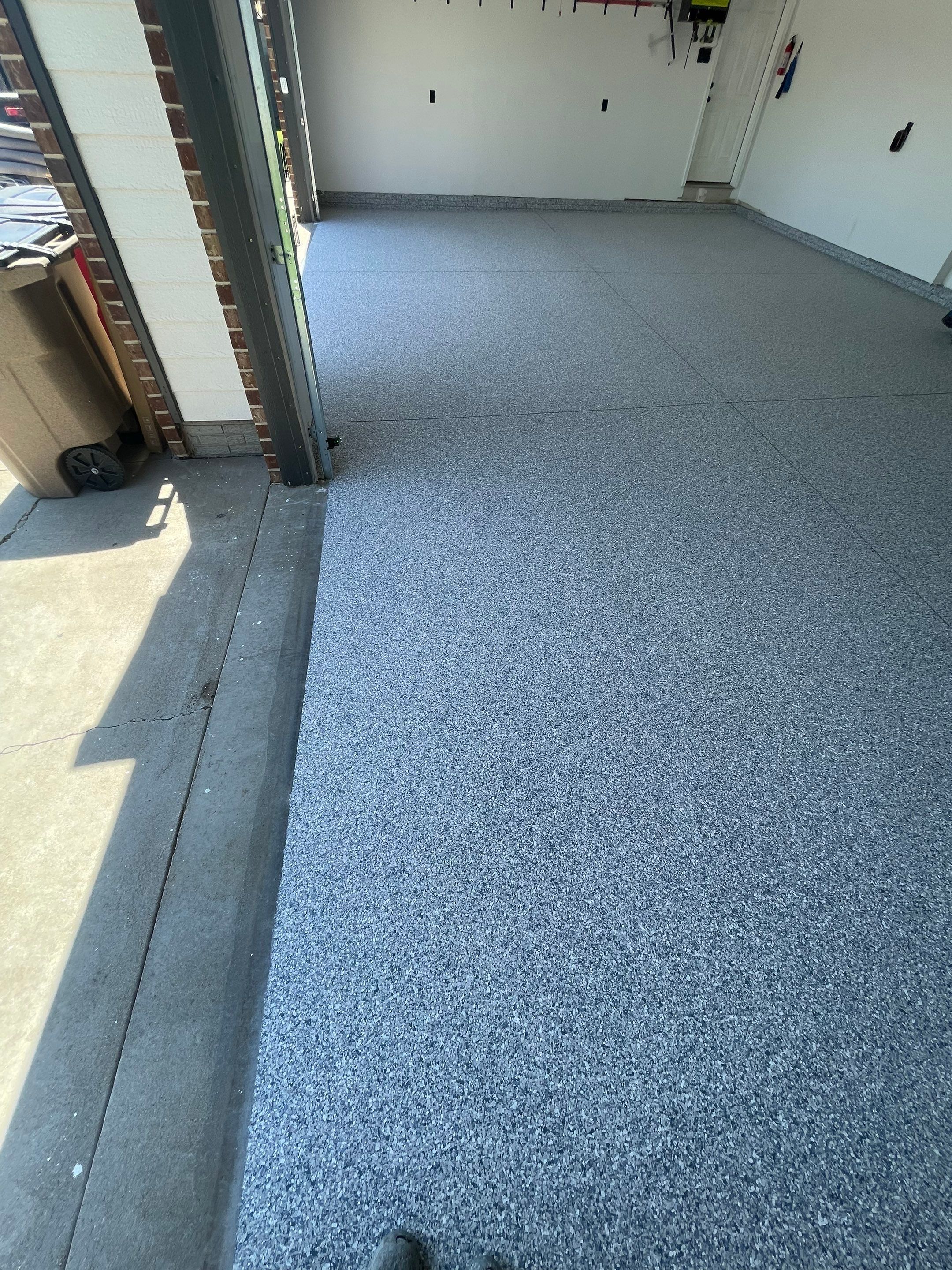 Tidal Wave Flake Garage Floor Installation in Sioux Falls by Select Painting, Coatings & Garage Cabinets