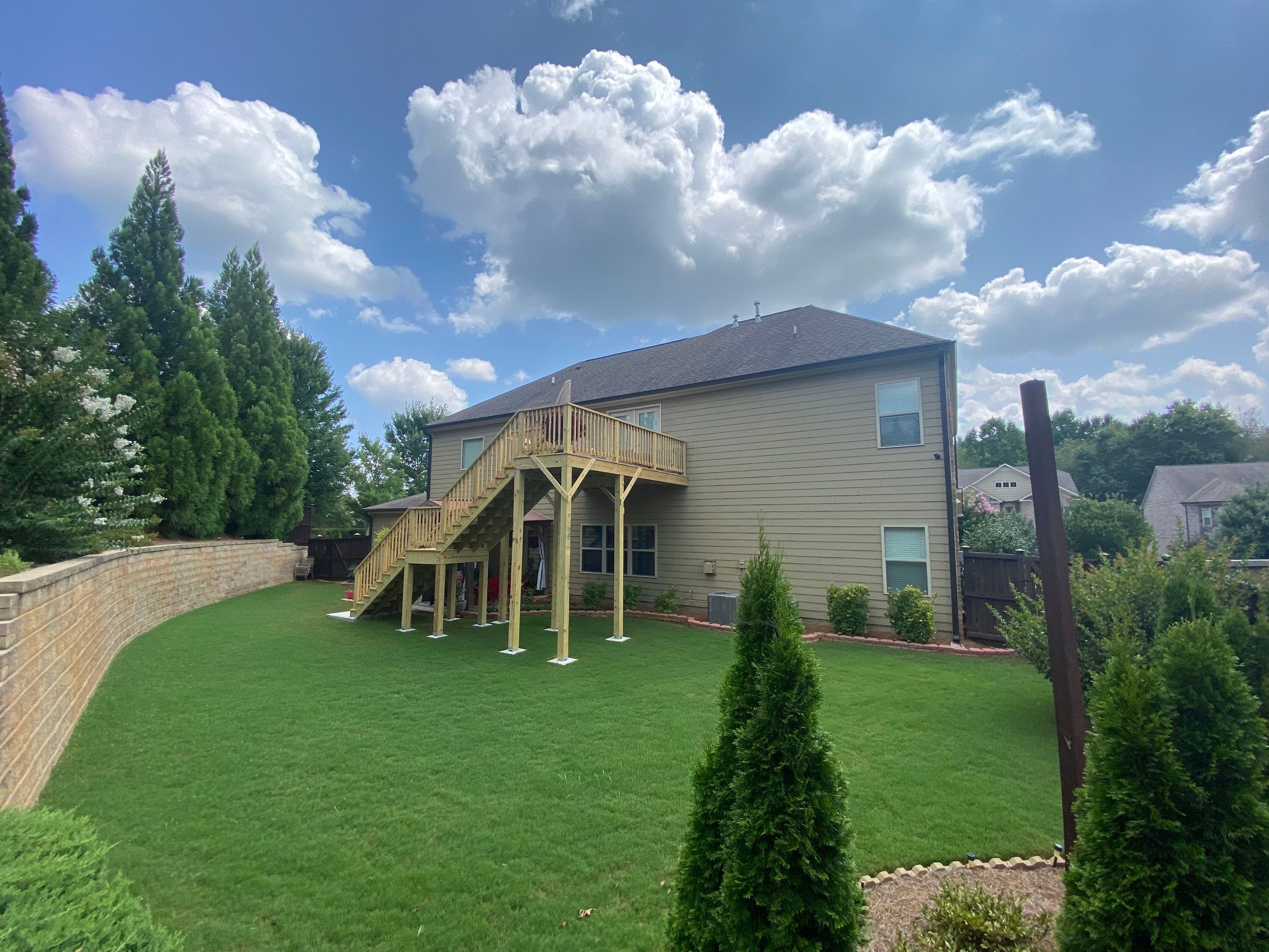 Pressure-Treated Wood Deck and Staircase Construction in Cumming, Georgia by Swift Home Renovations