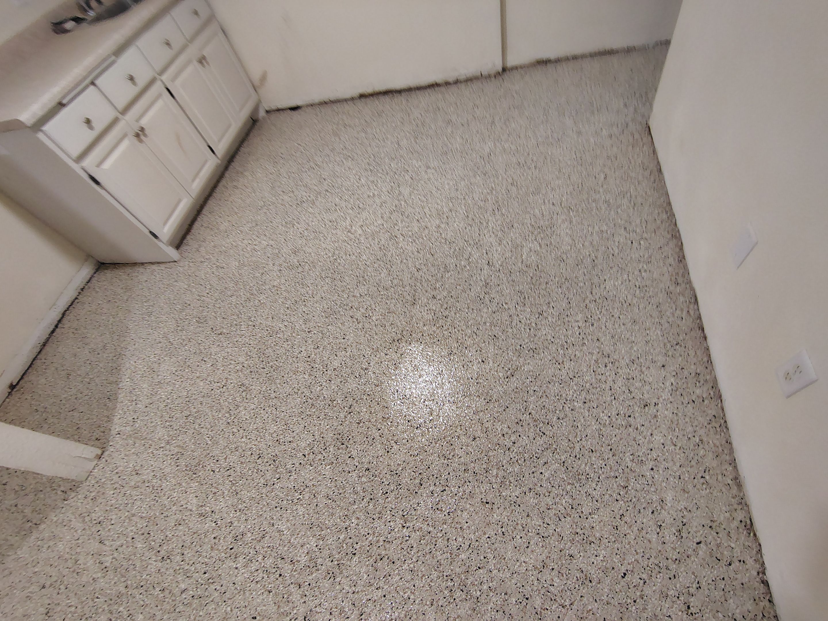 Comprehensive Basement Concrete Floor Coating and Crack Repair in Sioux Falls by Select Painting, Coatings & Garage Cabinets