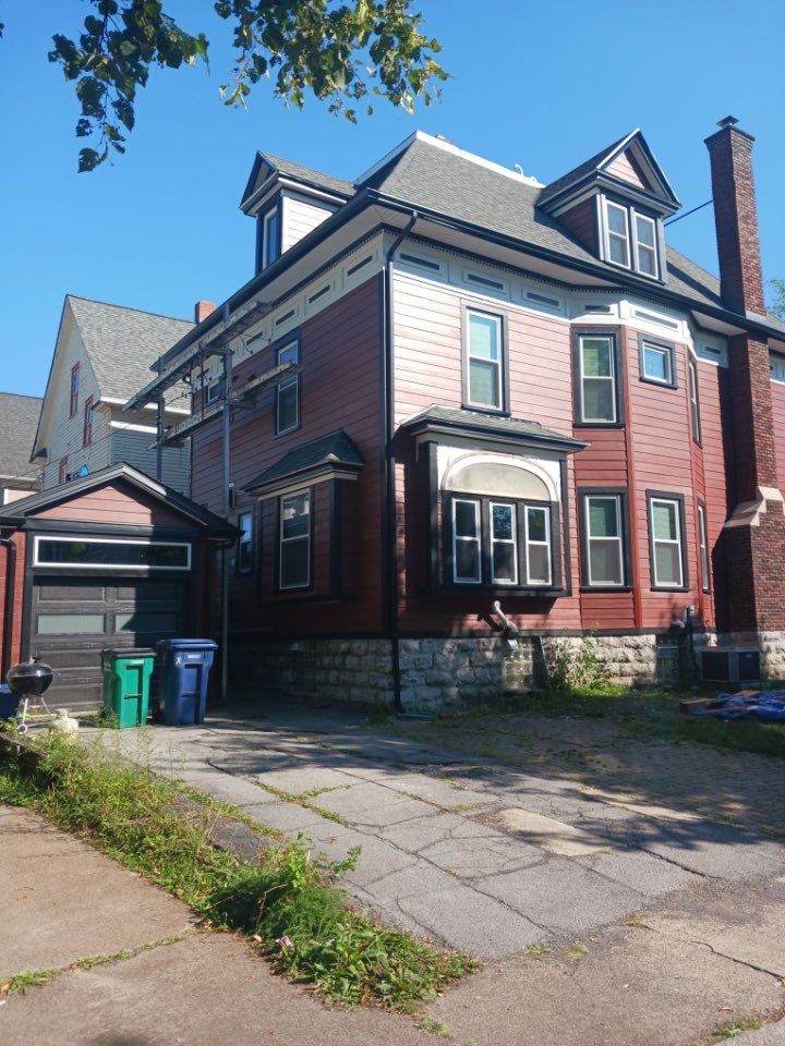Exterior Renovations- Siding, Stamped Concrete, Porch, and Railings by Ivy Lea Construction