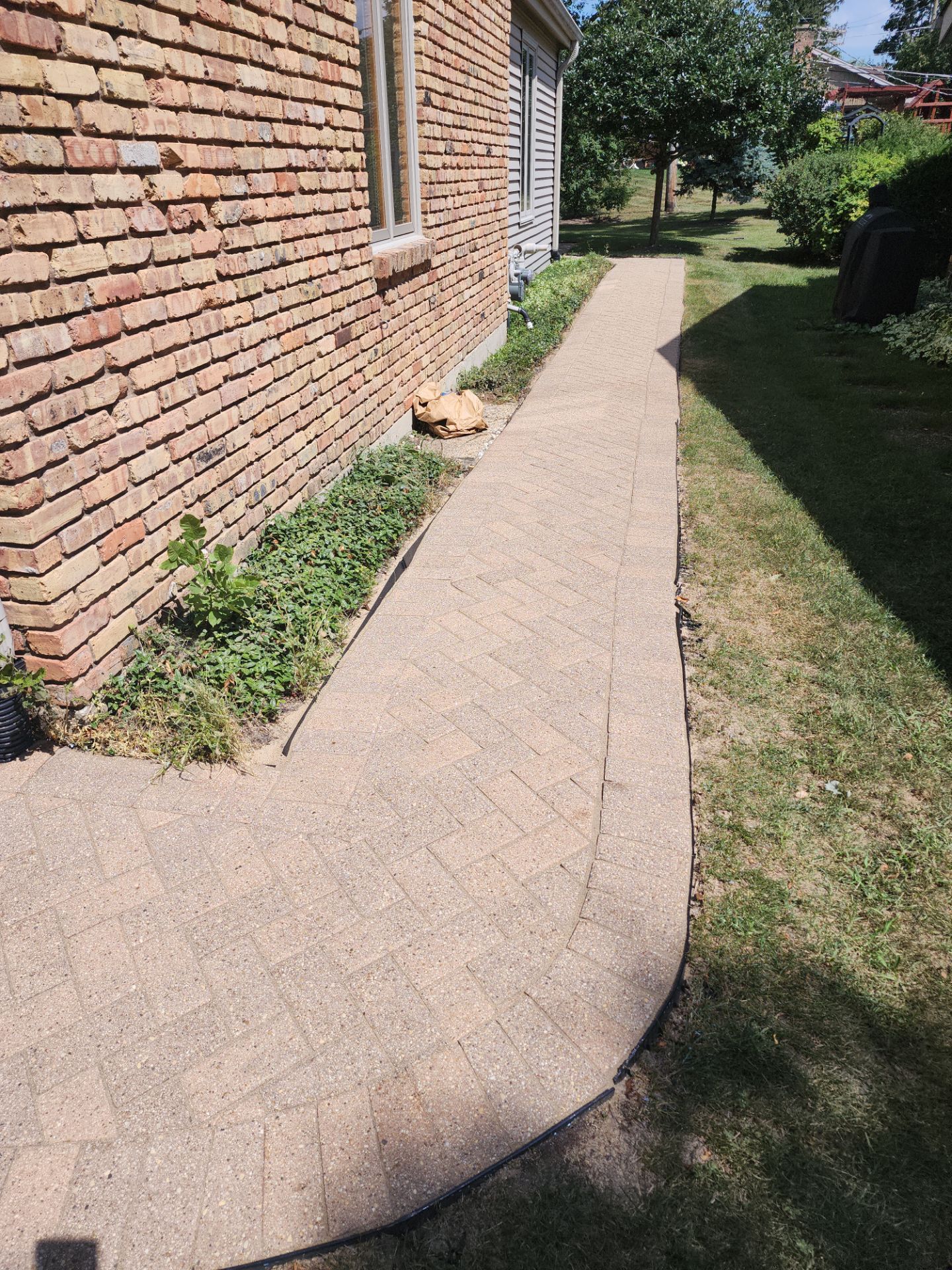 Arlington Heights Brick paver repair, cleaning and sealing by Northern Power Washing LLC.