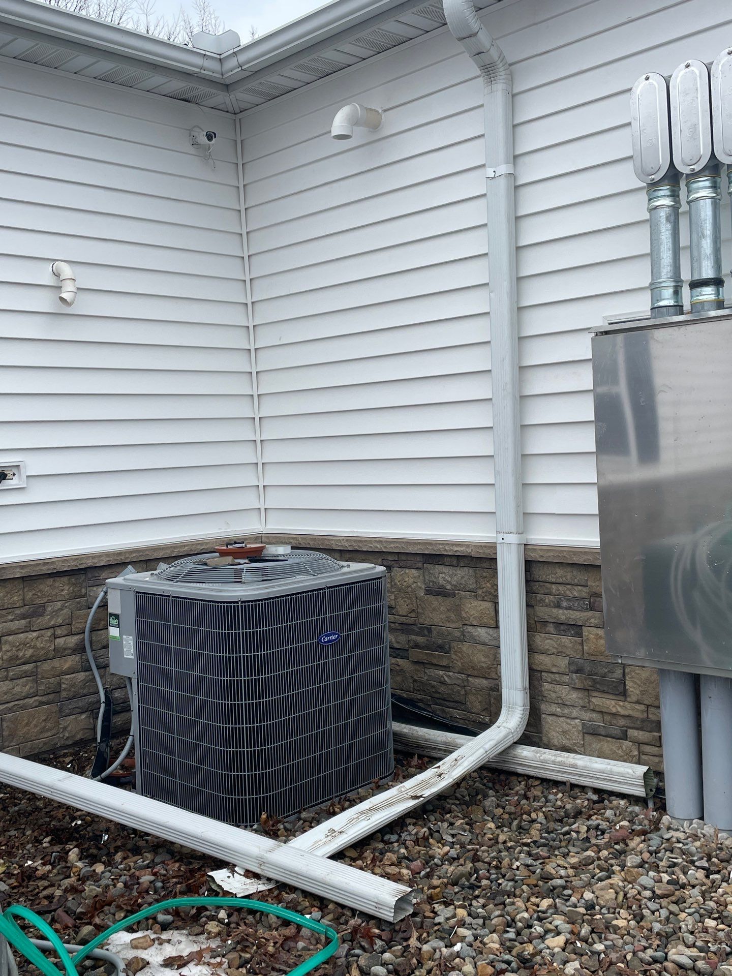 Siding and Stone Installation using Extrerior Porfolio Vinyl Siding and Versetta Stone by EEC  Windows, Siding & Roofing 