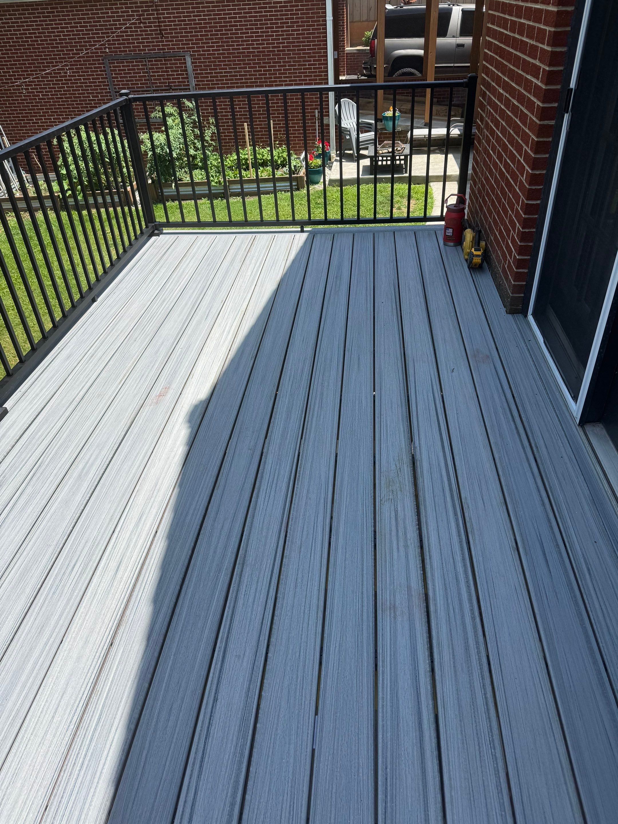 Elevated Composite Deck Rebuild with Black Metal Railing in Lewisburg by Walnut Hollow Decks & Outdoor Living
