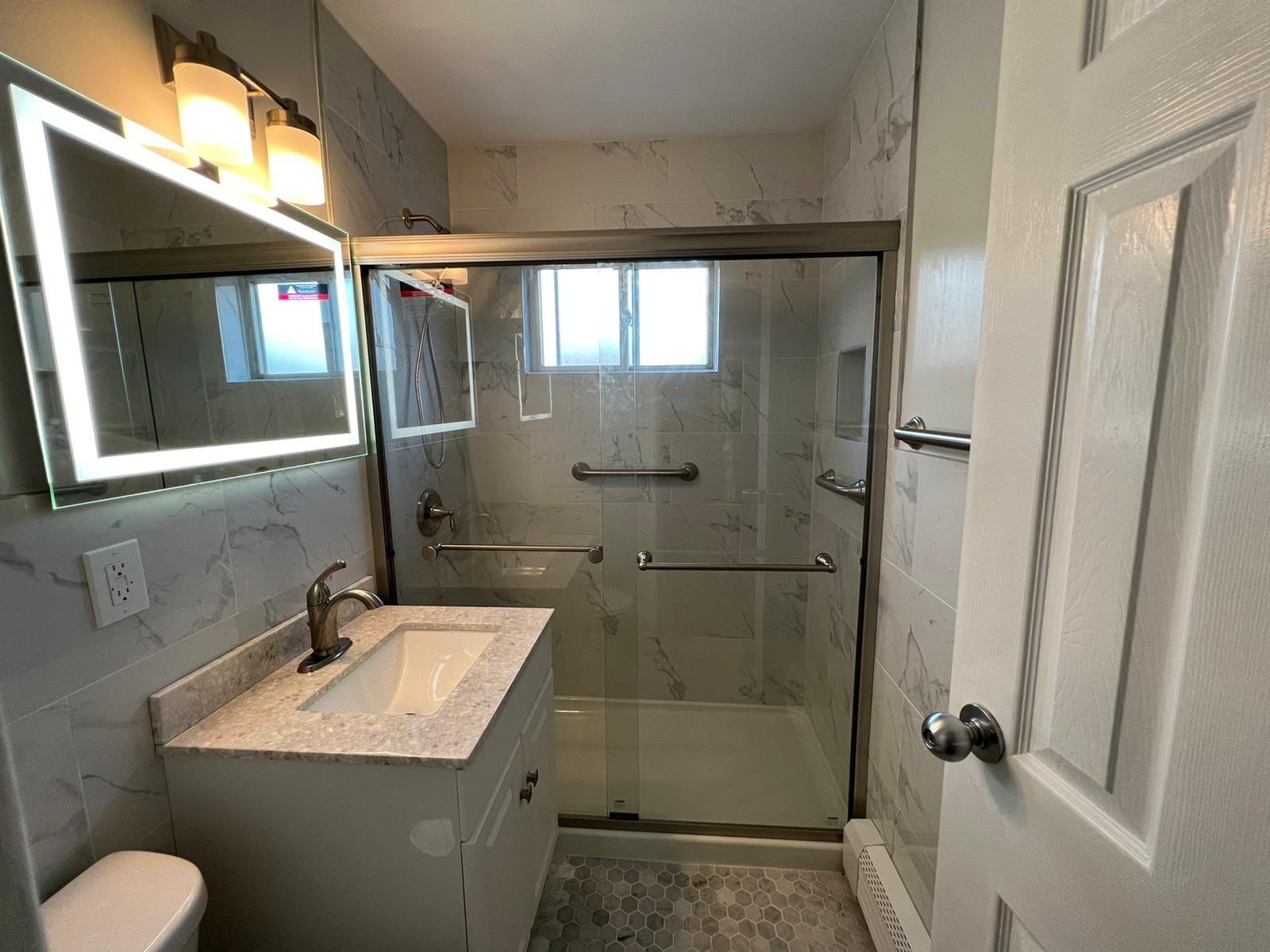 Bathroom Remodel using Tile by Home Concepts Construction