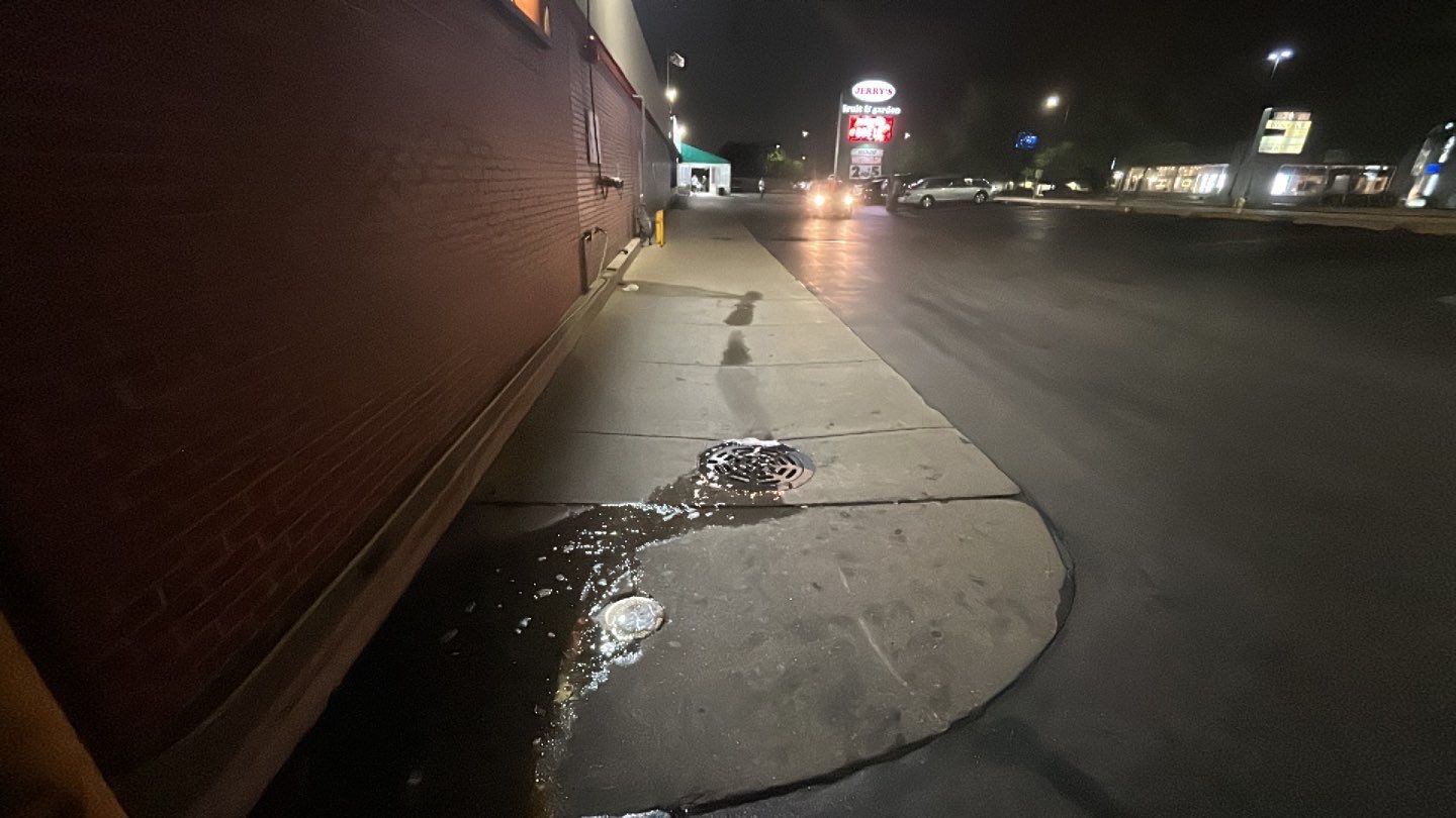 Concrete sidewalk cleaning and degreasing by Northern Power Washing LLC.