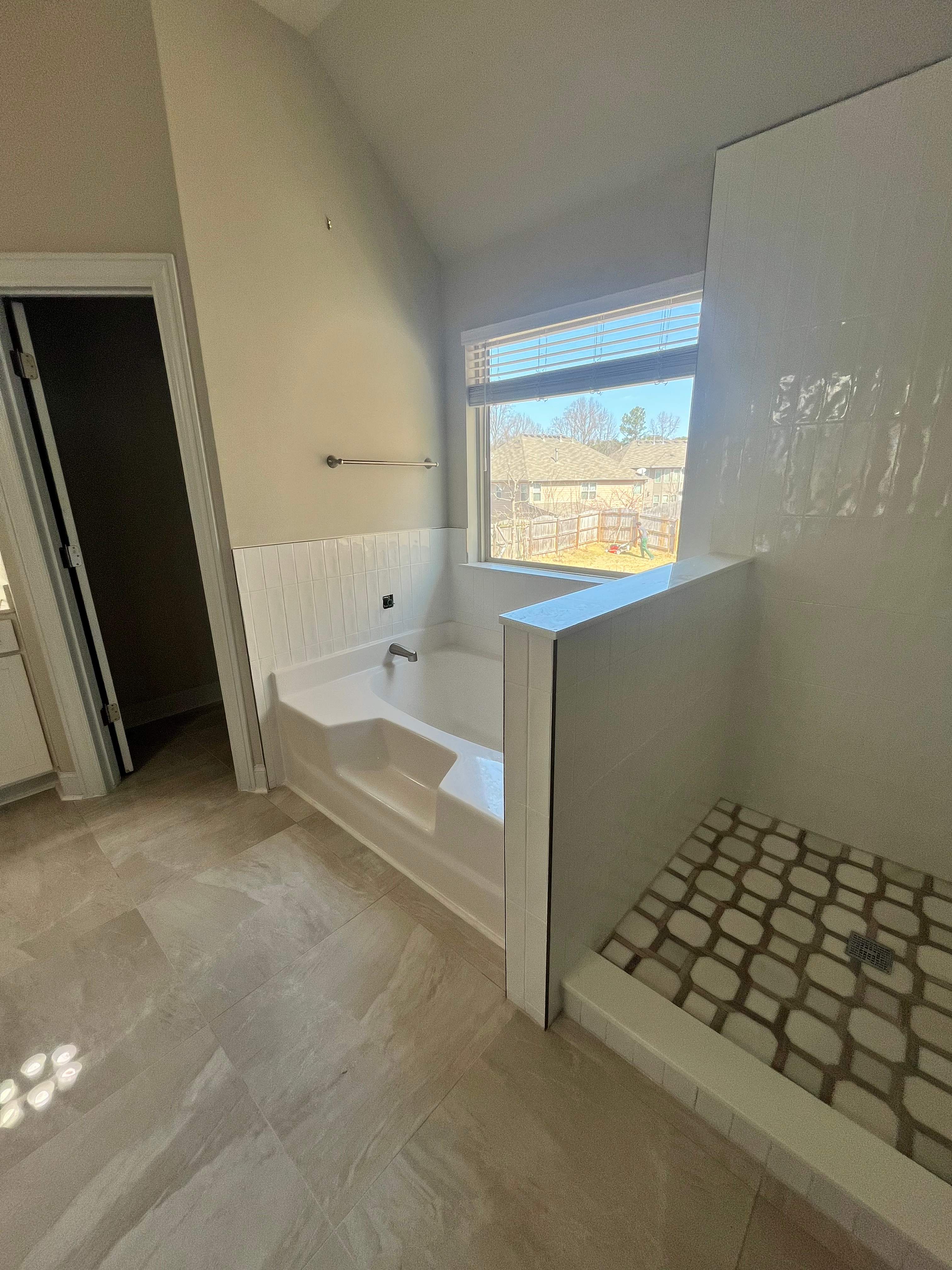 Shower retile and bathroom flooring by Prudencio