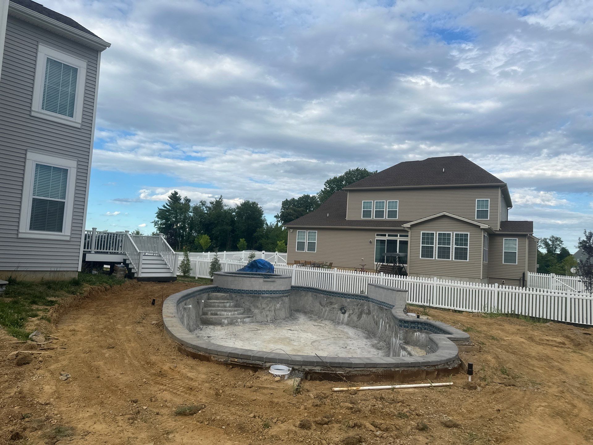 Pool and Hardscape Design in Delaware | Belgard Paver Patio & Outdoor Living Space by Studio G Indoor Spaces & Outdoor Living