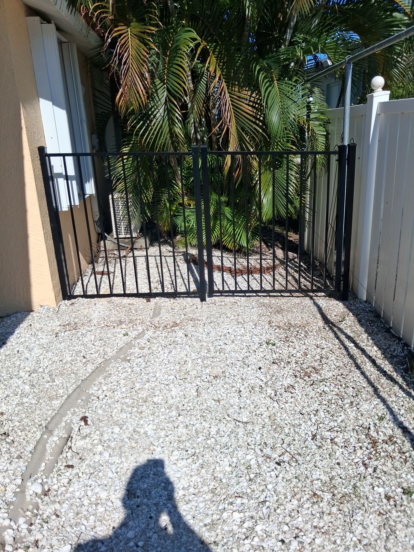 Black Aluminum Picket Fence Installation for Port Charlotte Canal Home by True Fence LLC