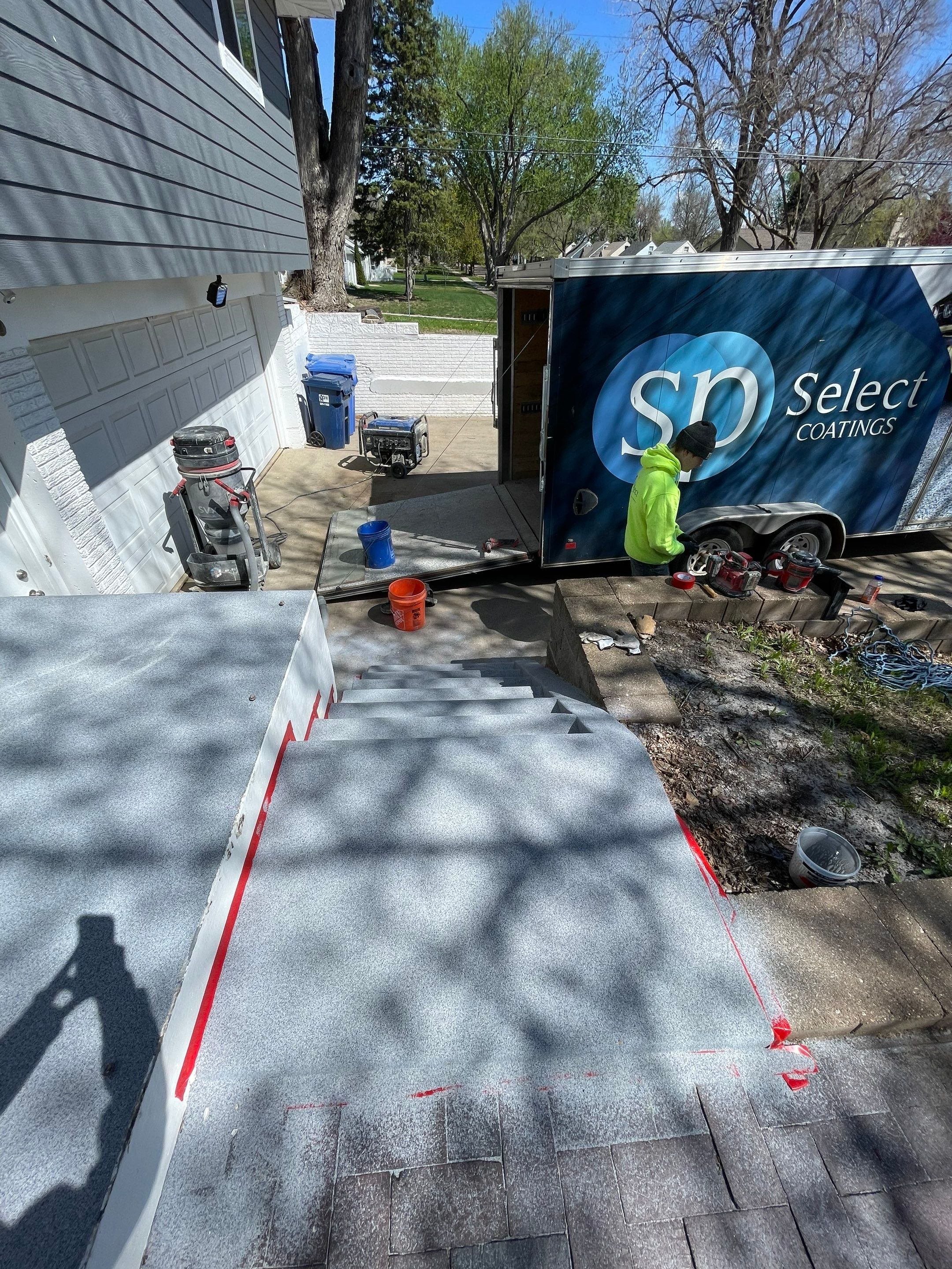 Grey Polyaspartic Porch and Stair Resurfacing in Sioux Falls by Select Painting, Coatings & Garage Cabinets