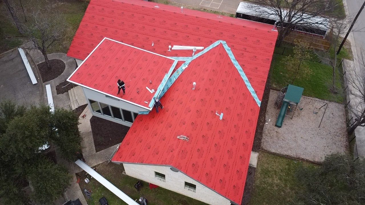 Commercial Roofing Installation using 24 GA Double-Lock - Galvalume by Action Exteriors Austin