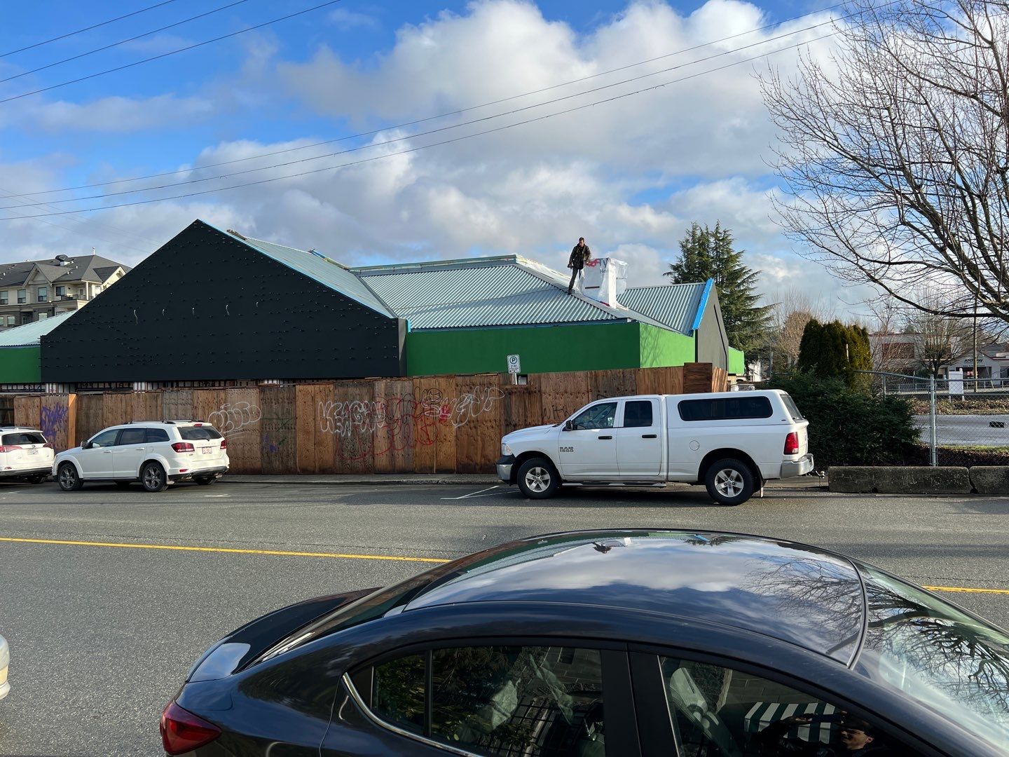 Commercial Roofing Installation using 12" Prolok metal and hidden gutters! by Top Notch Roofing Inc