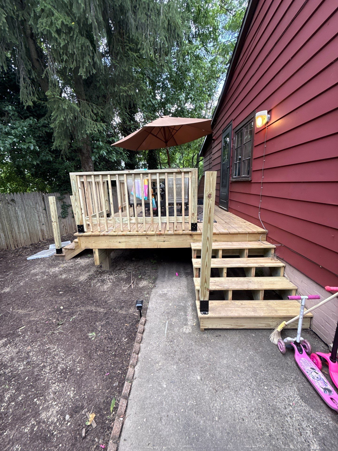 Roof sunspace deck  by Cousins Roofing Siding & Decks