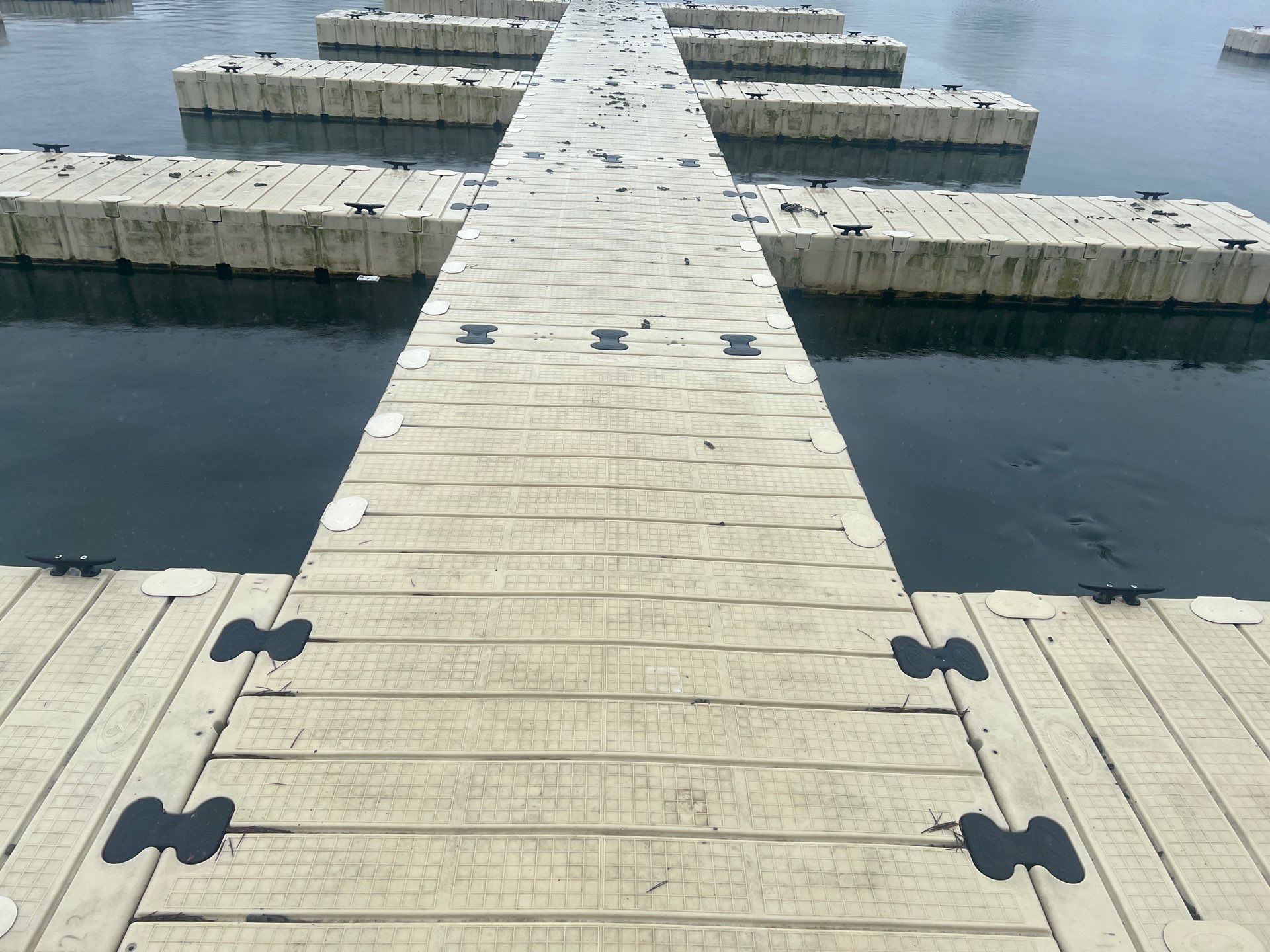 Power washing of floating dock by Northern Power Washing LLC.