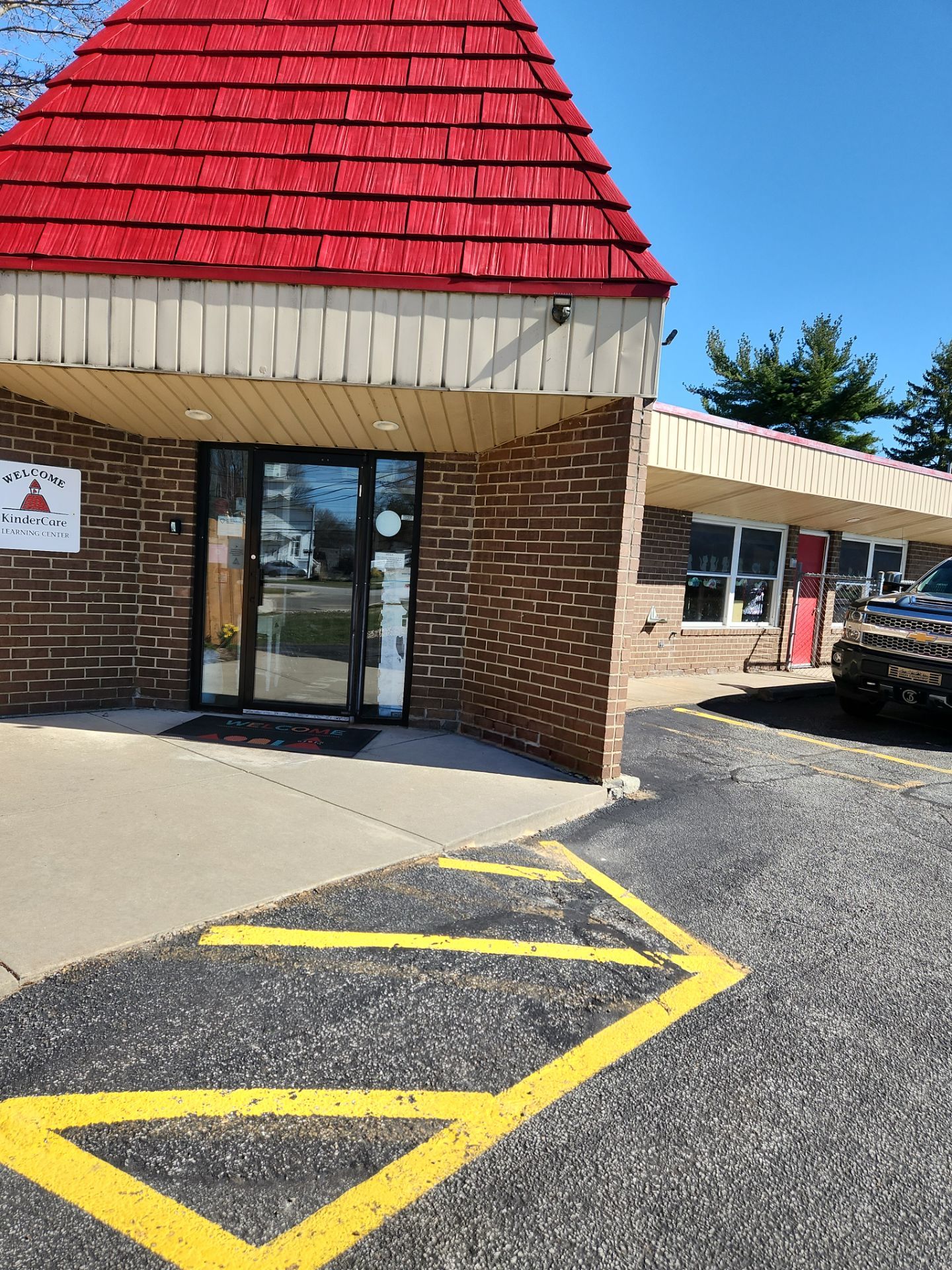 Commercial Roofing Repair using UniFlex Silicone Roof Coating on KinderCare Learning Center by 3 Daughters Construction 