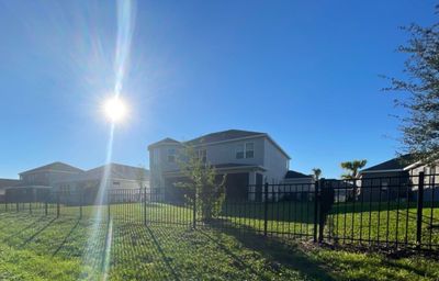 Aluminum Fence Installation using Black 3 Rail Aluminum Fence