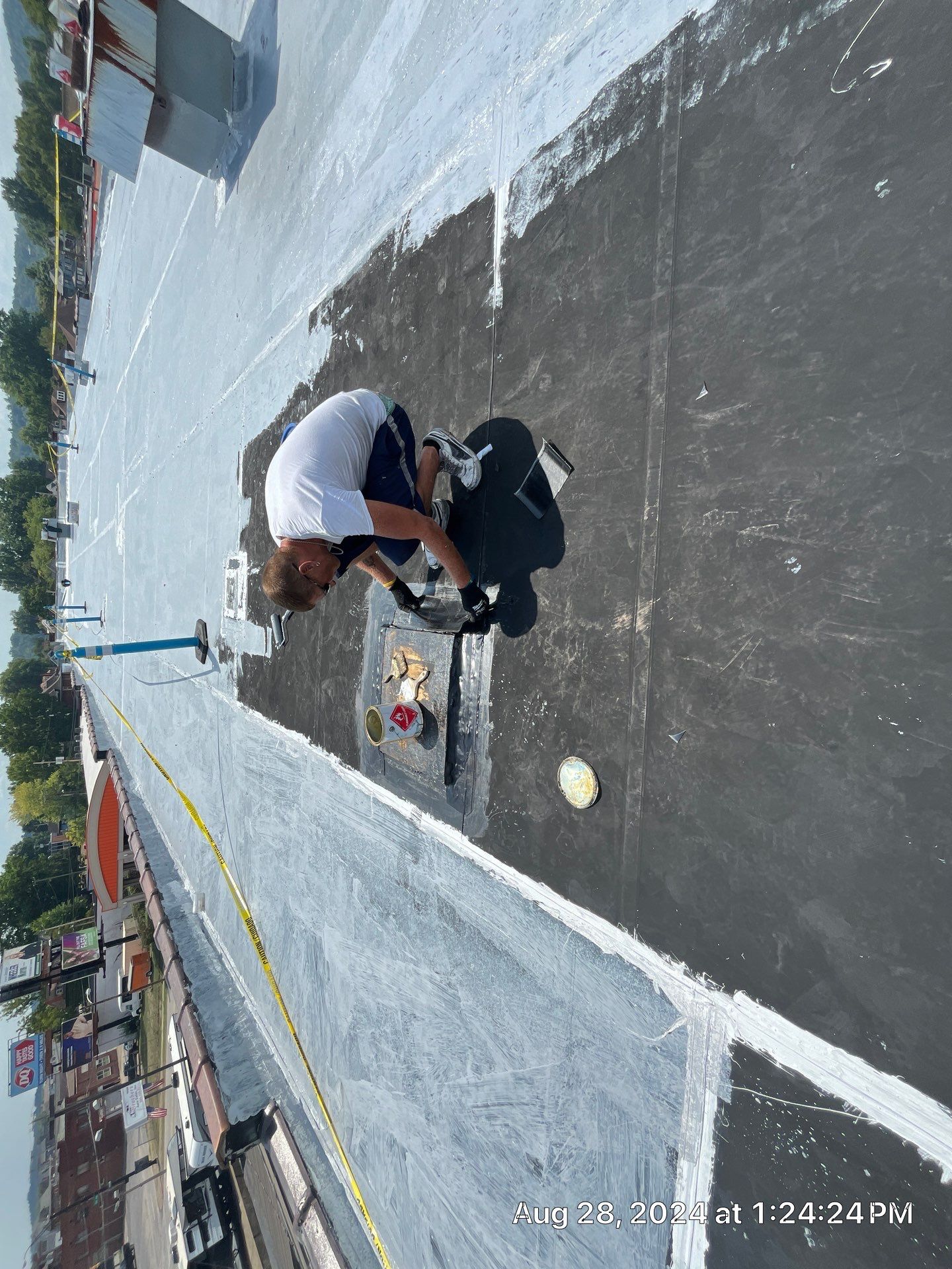 Commercial Roofing Installation using smartcoat Roof coating by Fahey Roofing + Contracting
