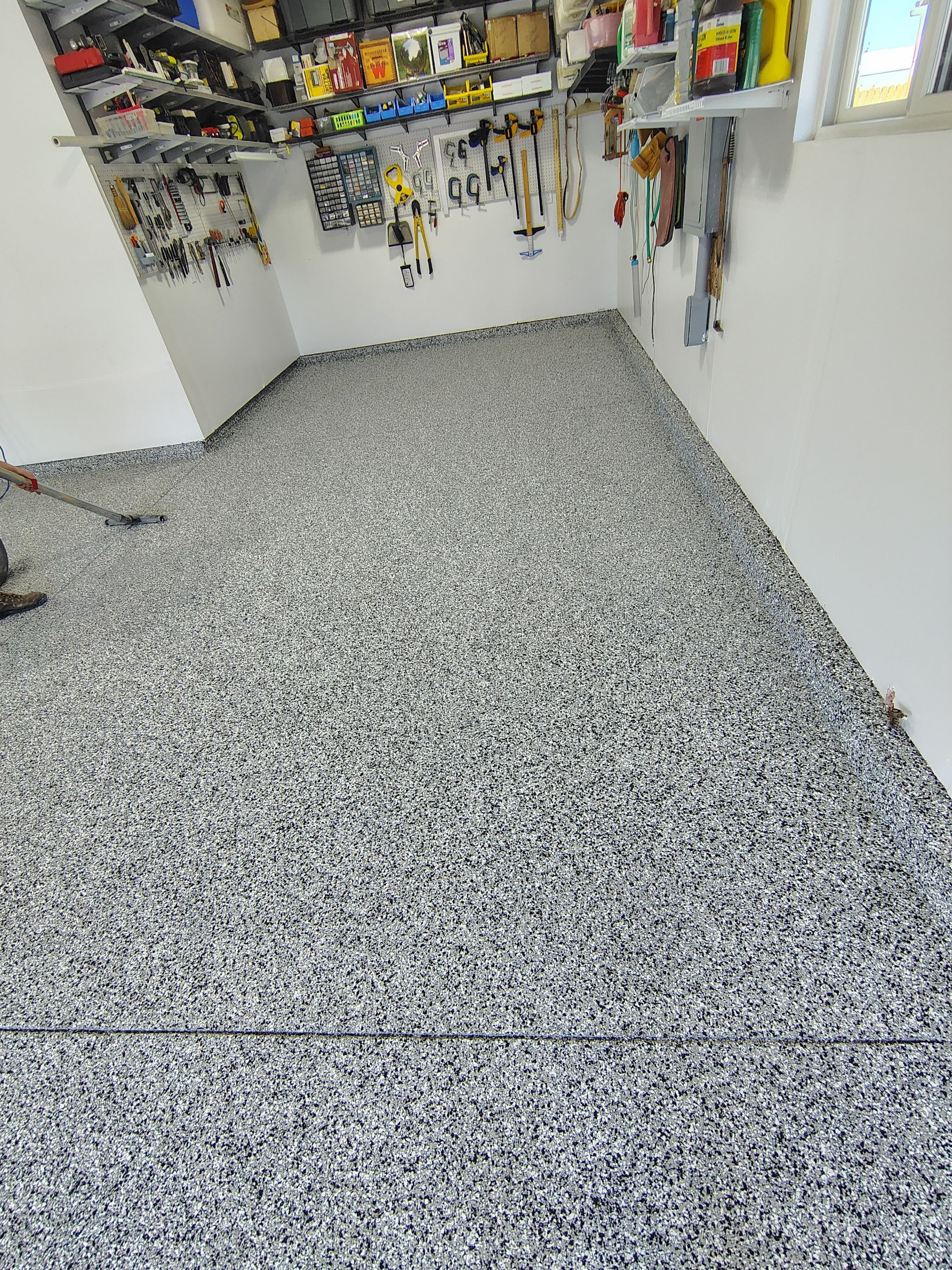 Decorative Flake Garage Floor Coating Installation in Tea, South Dakota by Select Painting, Coatings & Garage Cabinets