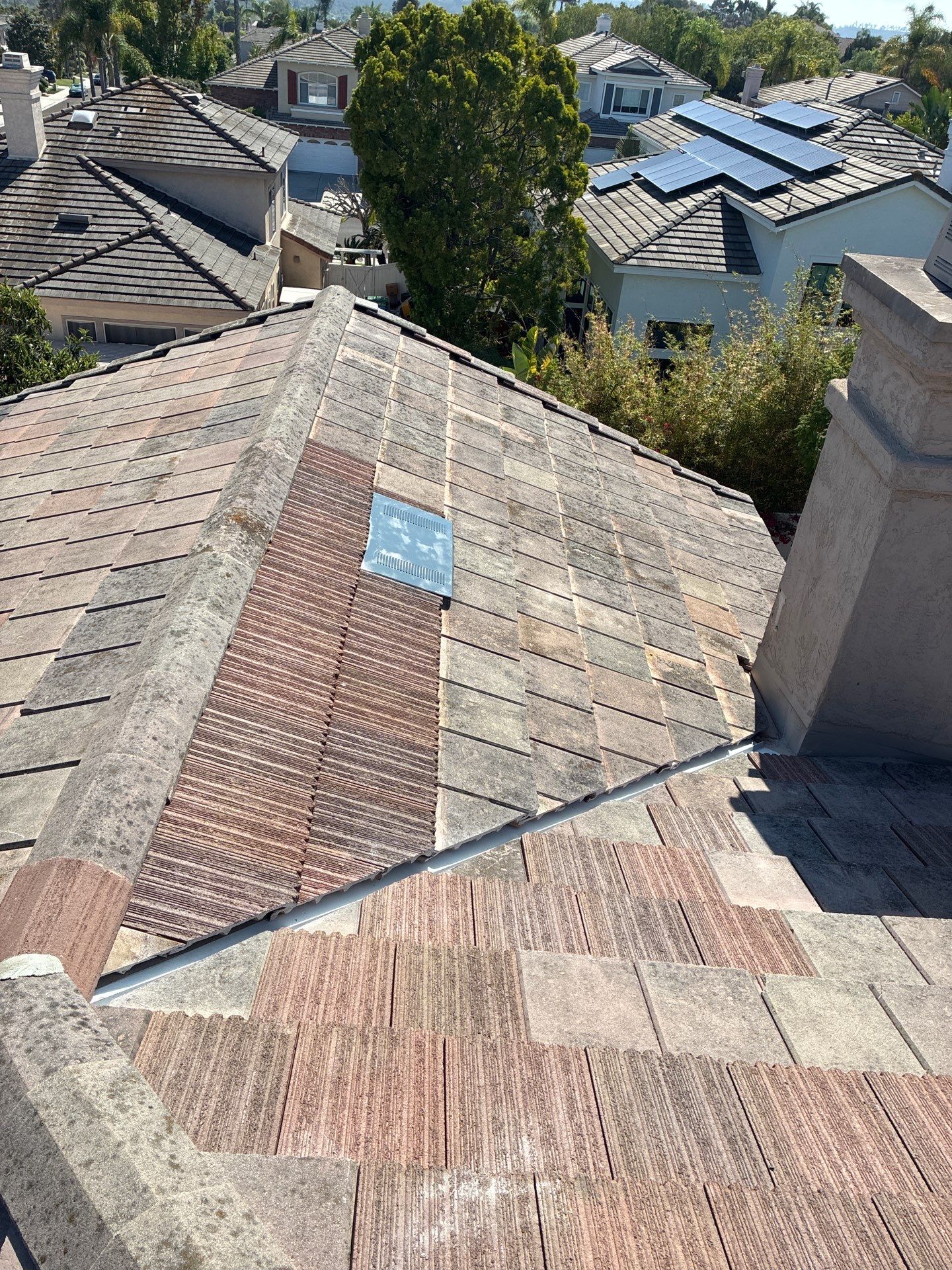 Carlsbad Concrete Tile Roof Replacement with Copper Flashing and Skylights by Reliable Roofing San Diego Inc.