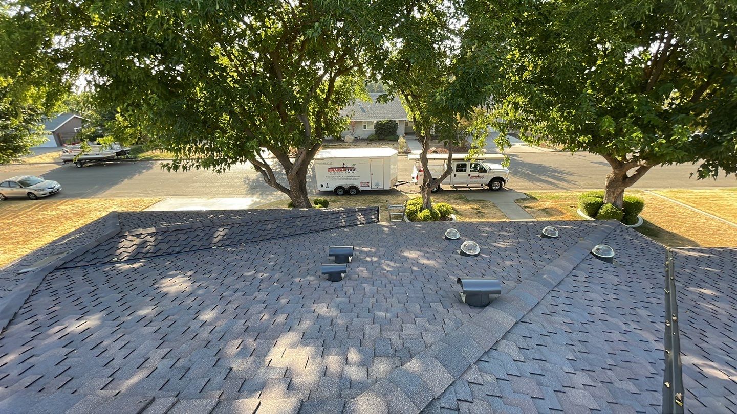 Installation of Certainteed Presidential shingles on residential house by Straight Edge Roofing Inc