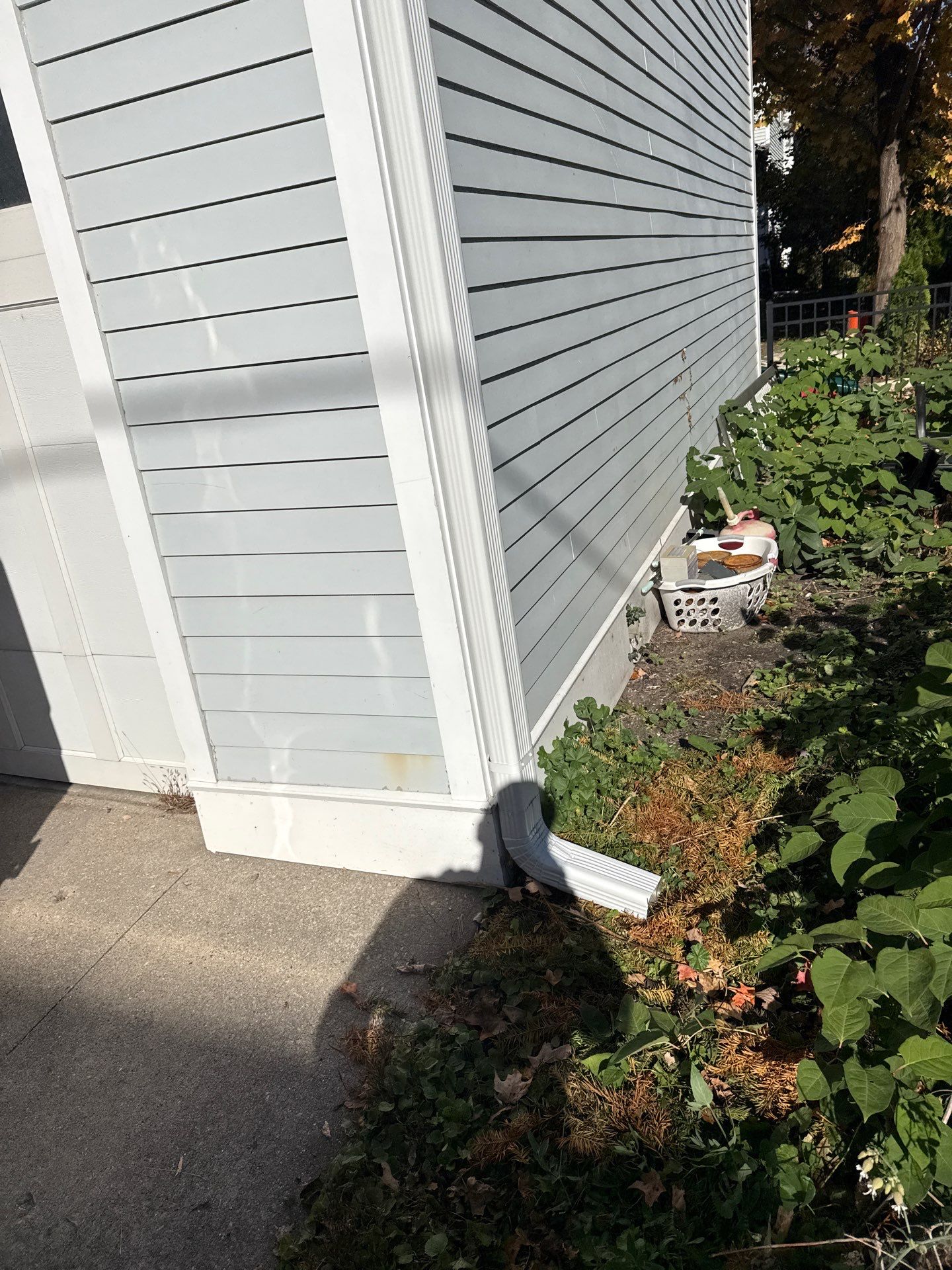 Seamless Gutter and Downspout Installation for Traverse City Garage by Rainbow Seamless Systems