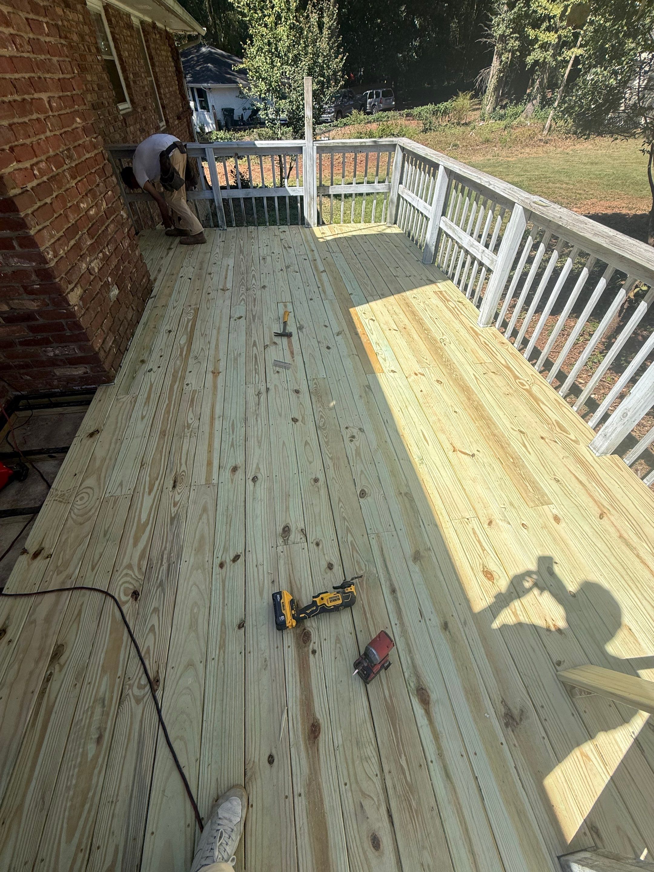 Pressure-Treated Wood Deck Replacement and Railing Installation in Marietta by Swift Home Renovations 
